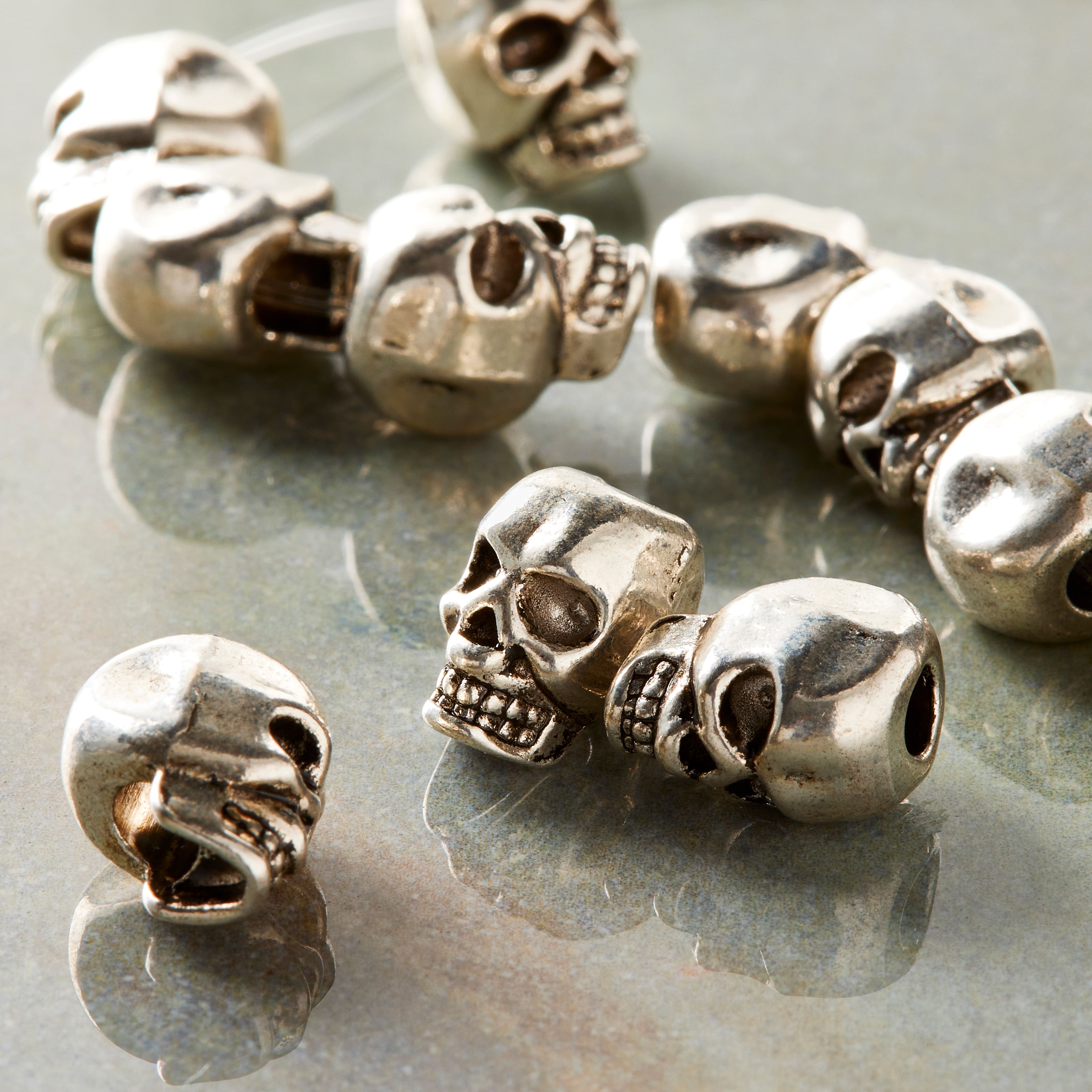 9 Packs: 12 ct. (108 total) Silver-Plated Metal Skull Beads, 12mm by Bead Landing™