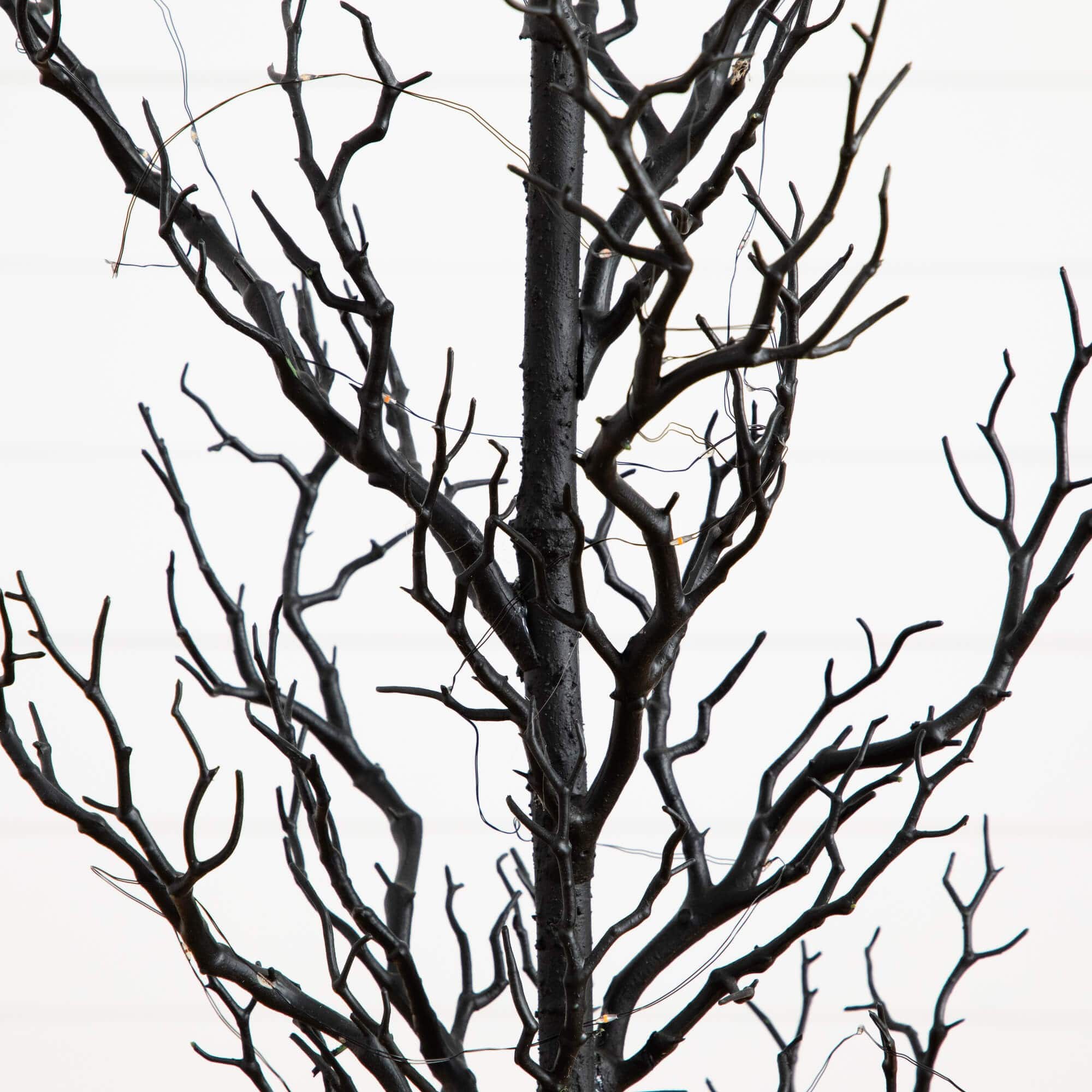 4ft. Pre-Lit Artificial Halloween Black Spooky Twig Tree with 160 Orange & Purple Copper Wire String LED Lights