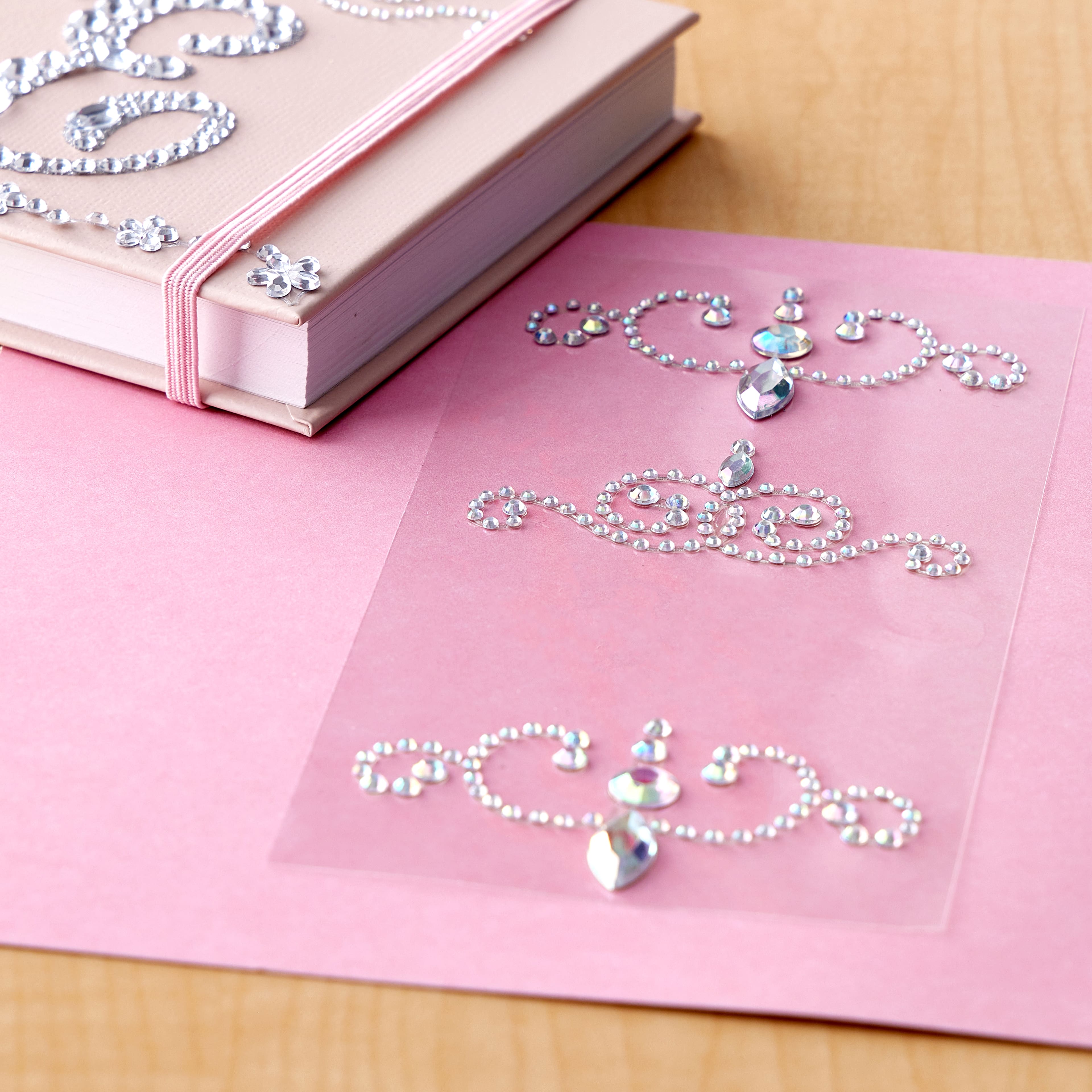 12 Packs: 4 ct. (48 total) Curved Flourish Adhesive Rhinestones by Recollections™