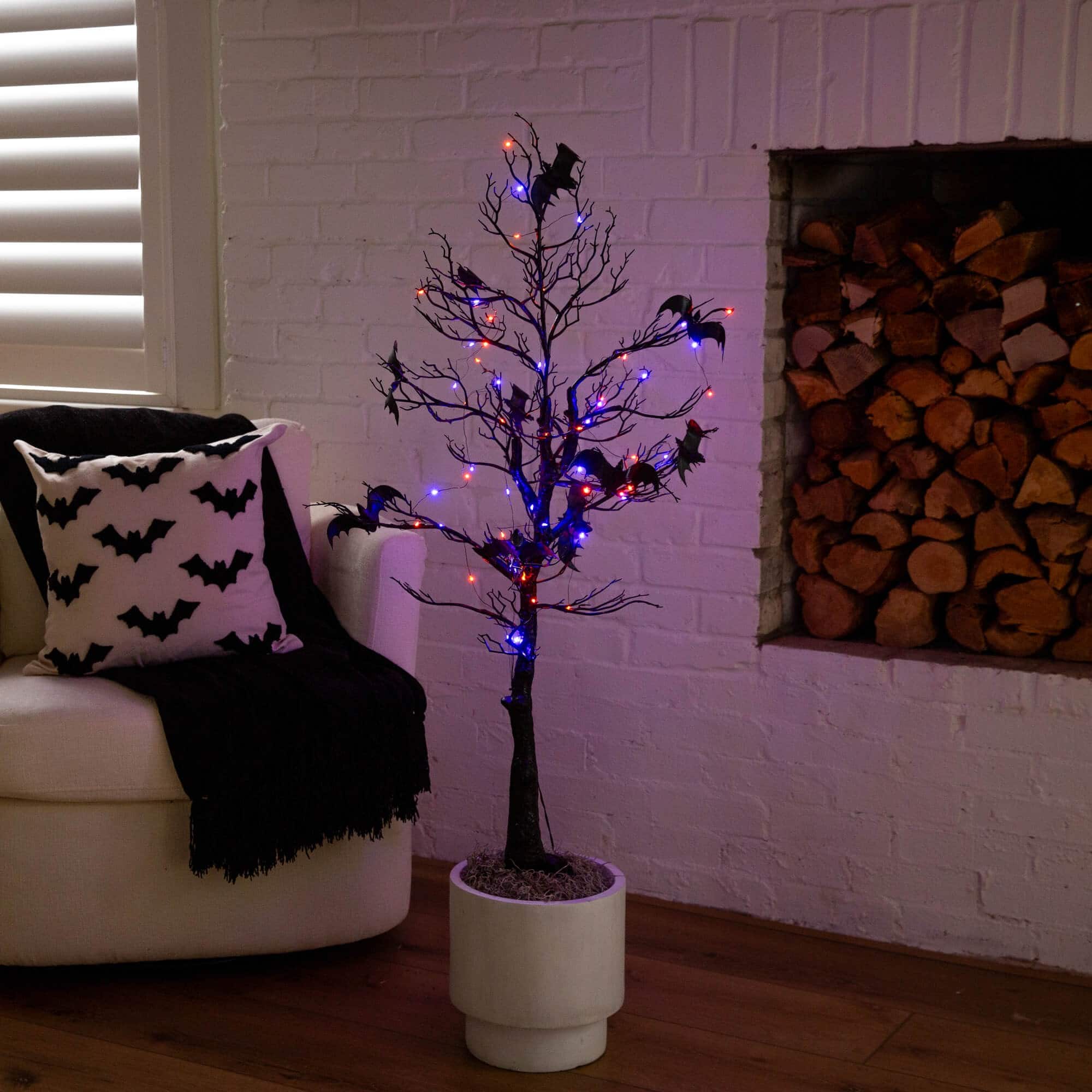 4ft. Pre-Lit Artificial Halloween Black Spooky Twig Tree with Bats and 120 Orange &#x26; Purple LED Lights