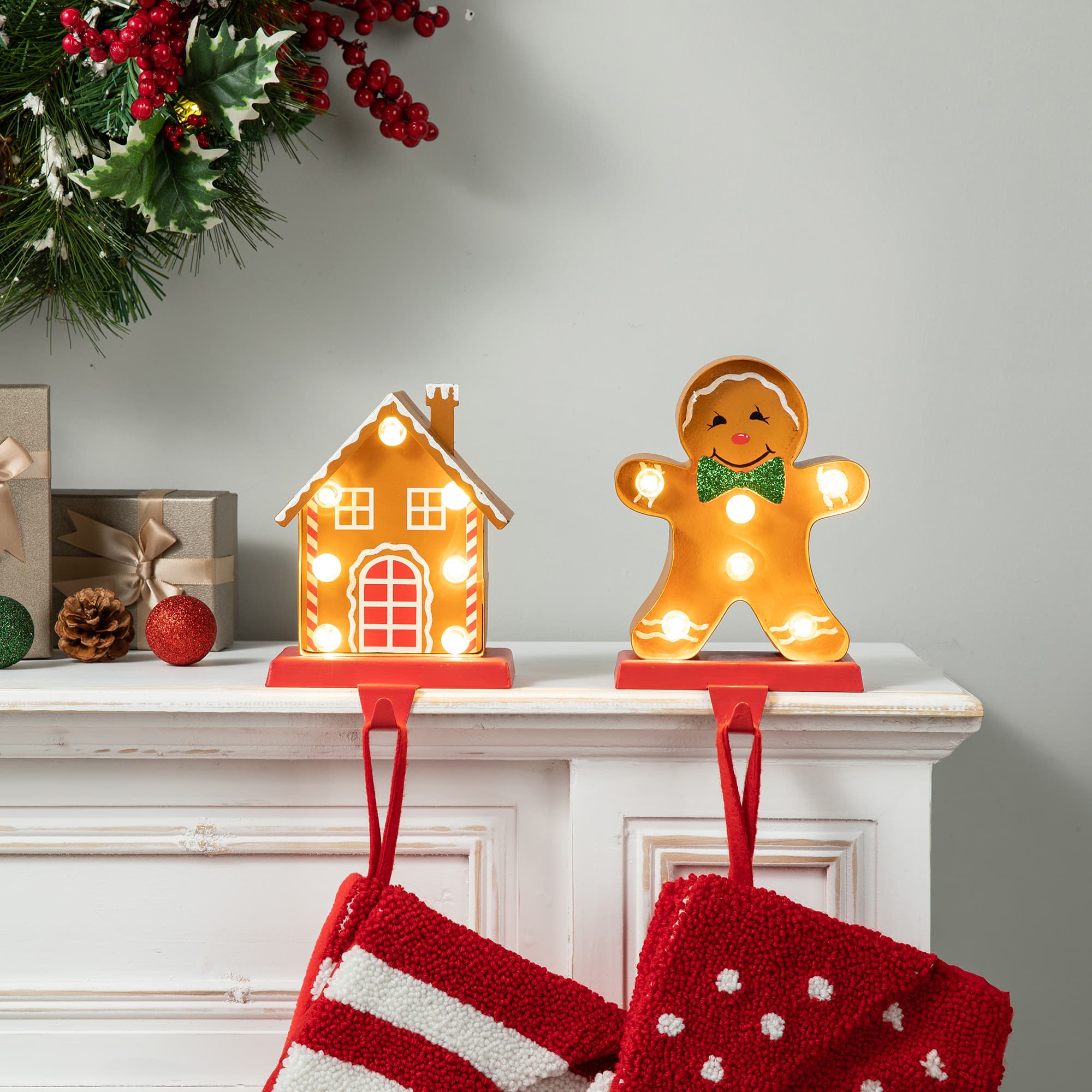 Glitzhome&#xAE; Marquee LED Gingerbread House &#x26; Gingerbread Man Christmas Stocking Holder Set