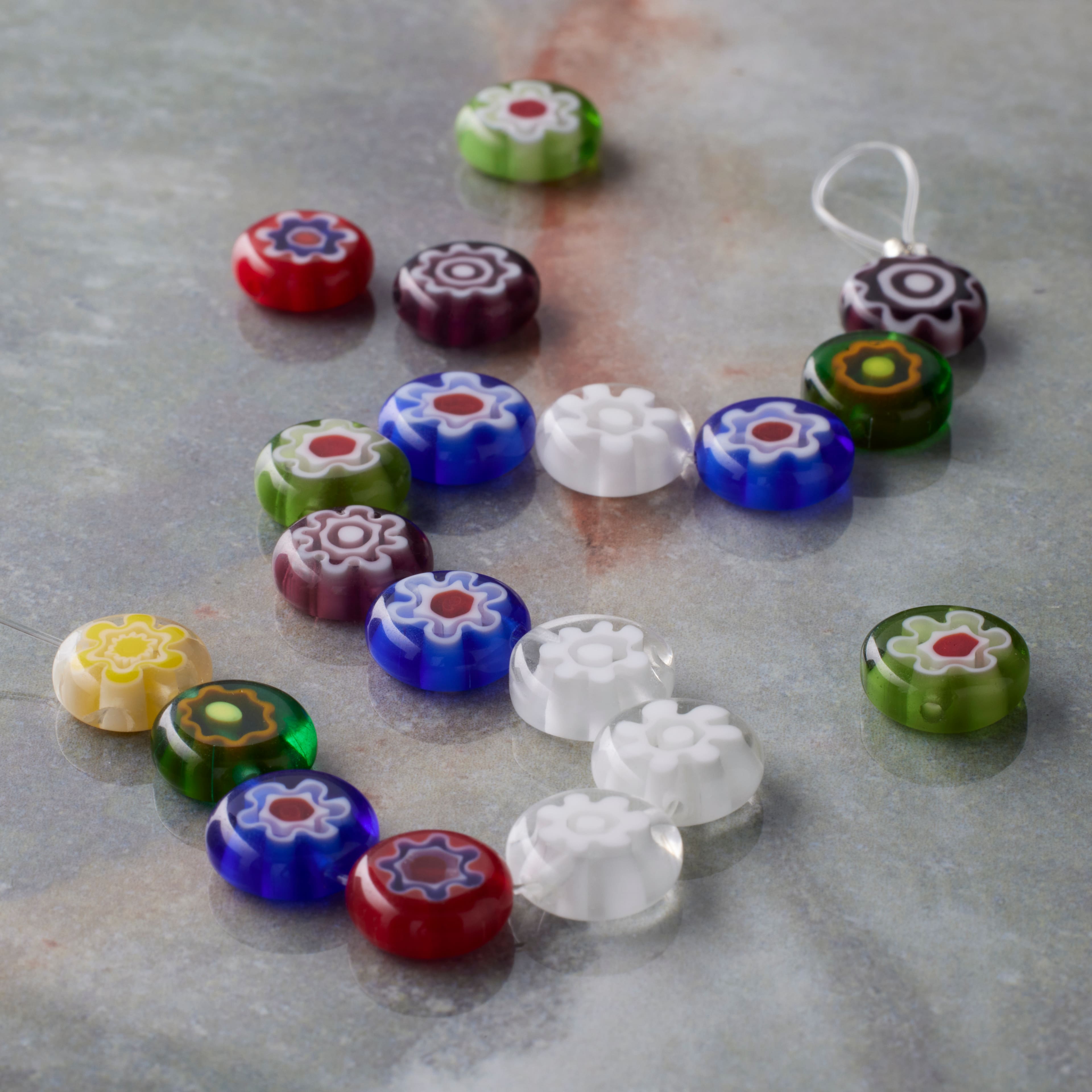 12 Packs: 19 ct. (228 total) Millefiori Flower Glass Coin Beads by Bead Landing™