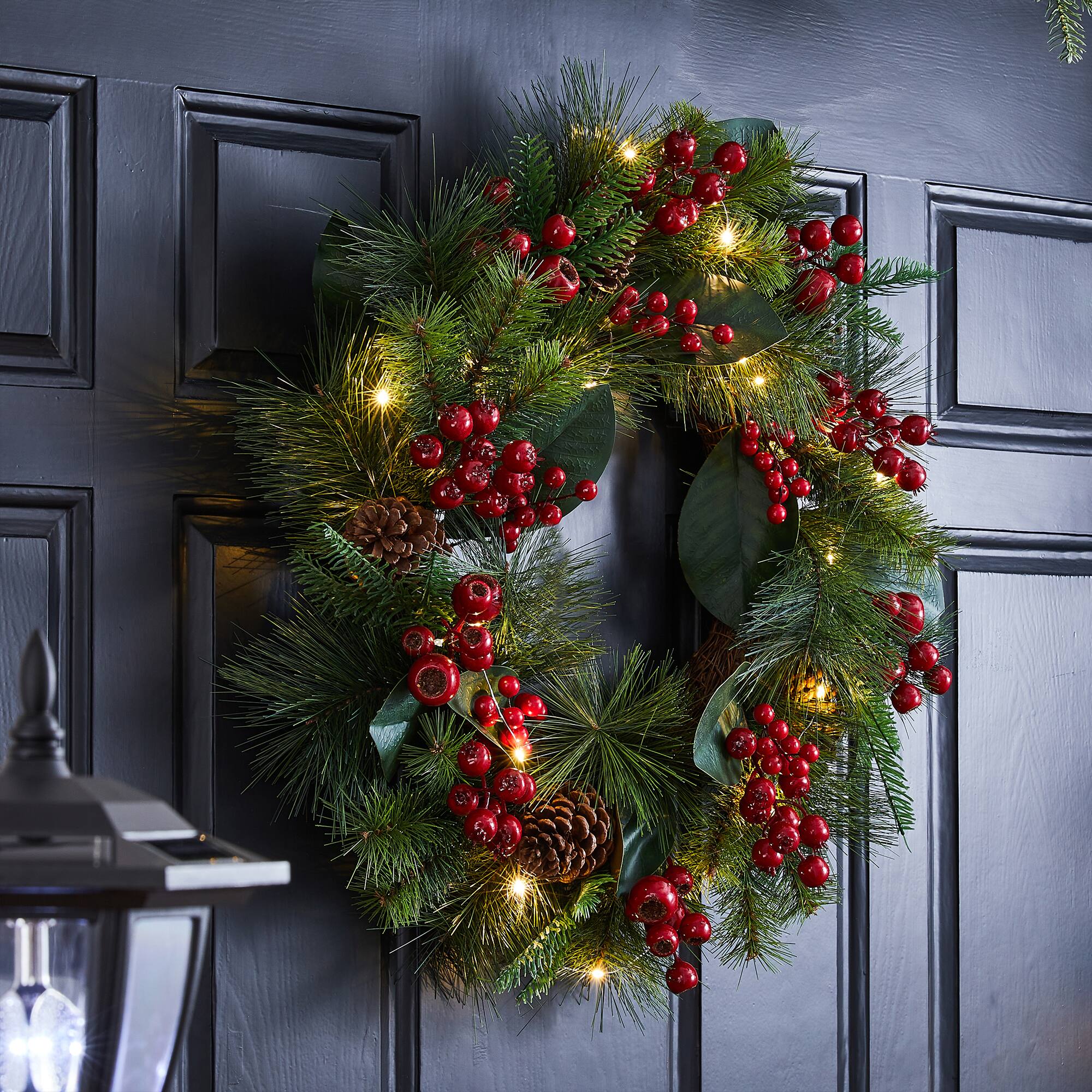 Glitzhome® 24" Pre-Lit Berry, Magnolia Leaf & Pinecone Wreath