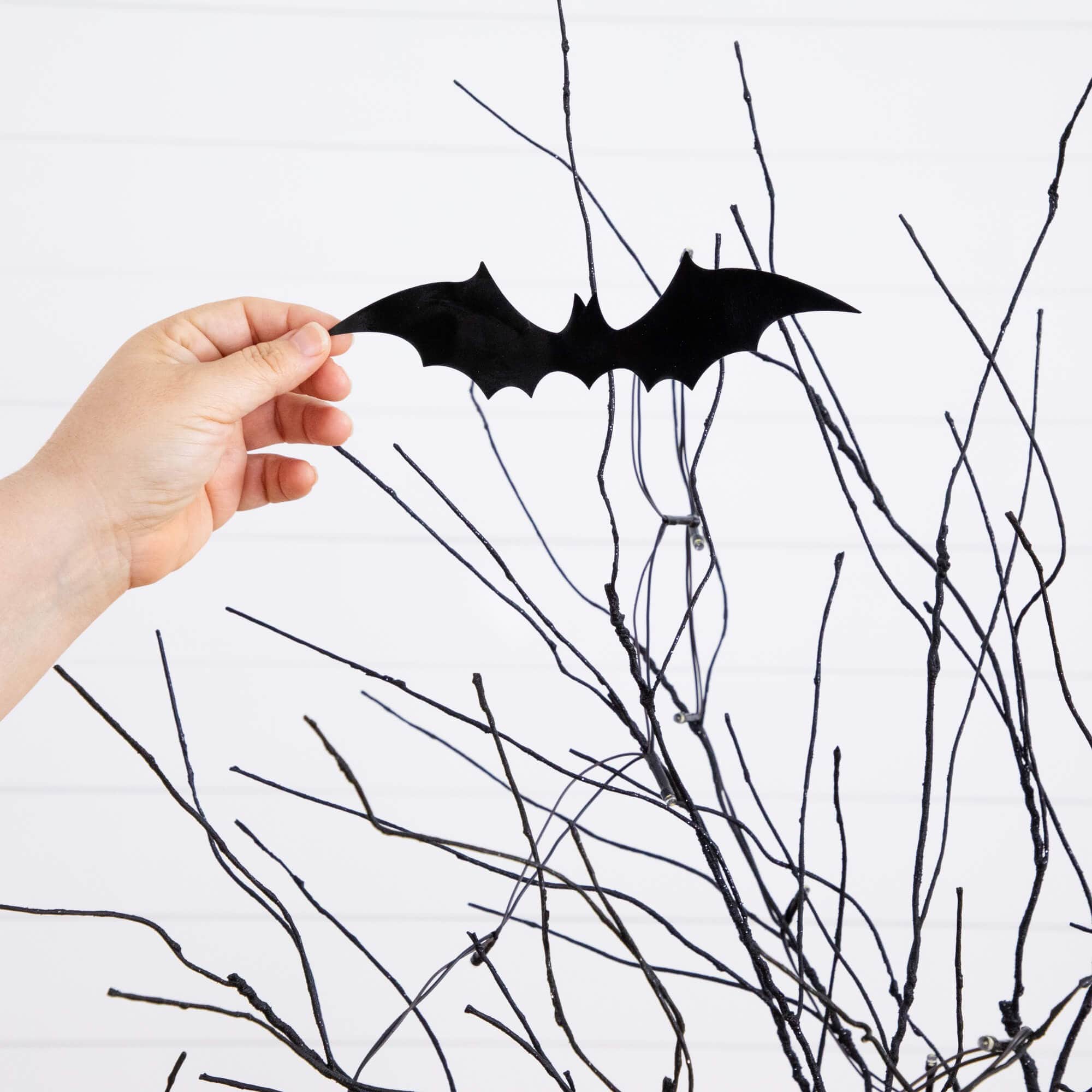 5ft. Pre-Lit Artificial Halloween Black Twig Tree with Bats and 50 Warm White LED Lights