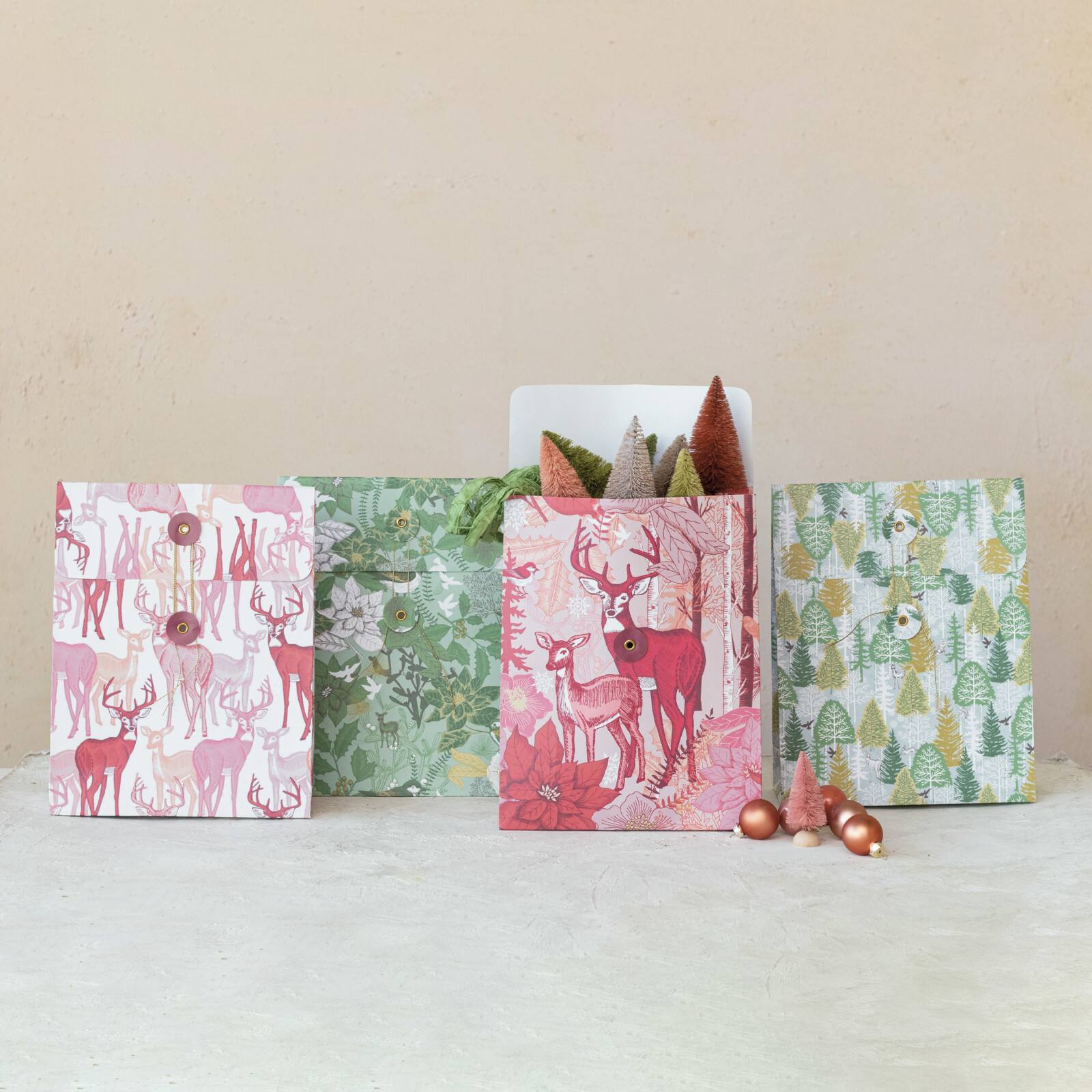Hello Honey Multicolor Reindeer, Tree &#x26; Flowers Printed Paper Gift Bags with Tie Closures, 4ct.