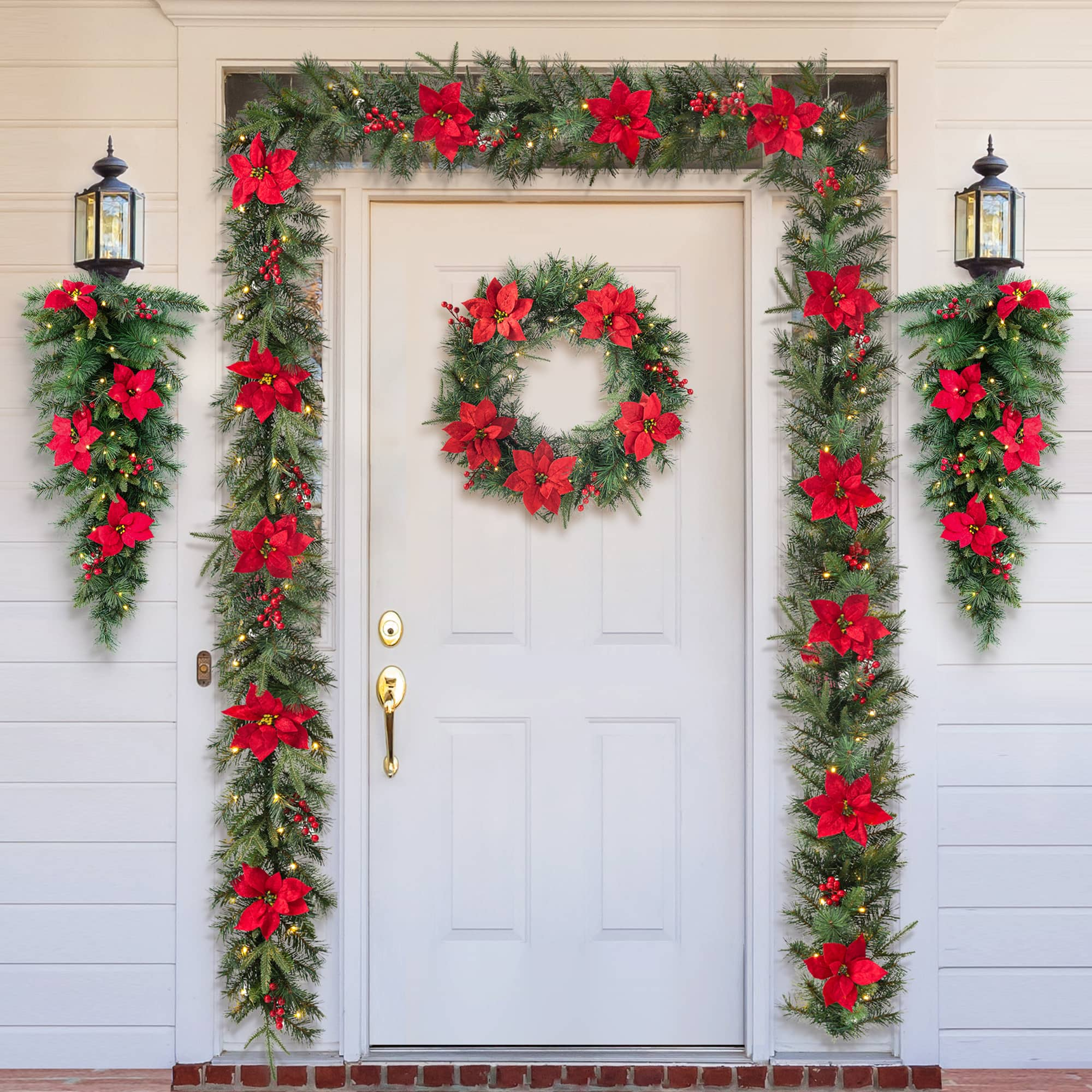 Glitzhome&#xAE; 9ft. Pre-Lit Greenery Pine Poinsettia and Berries Christmas Garland with LED Lights and Timer