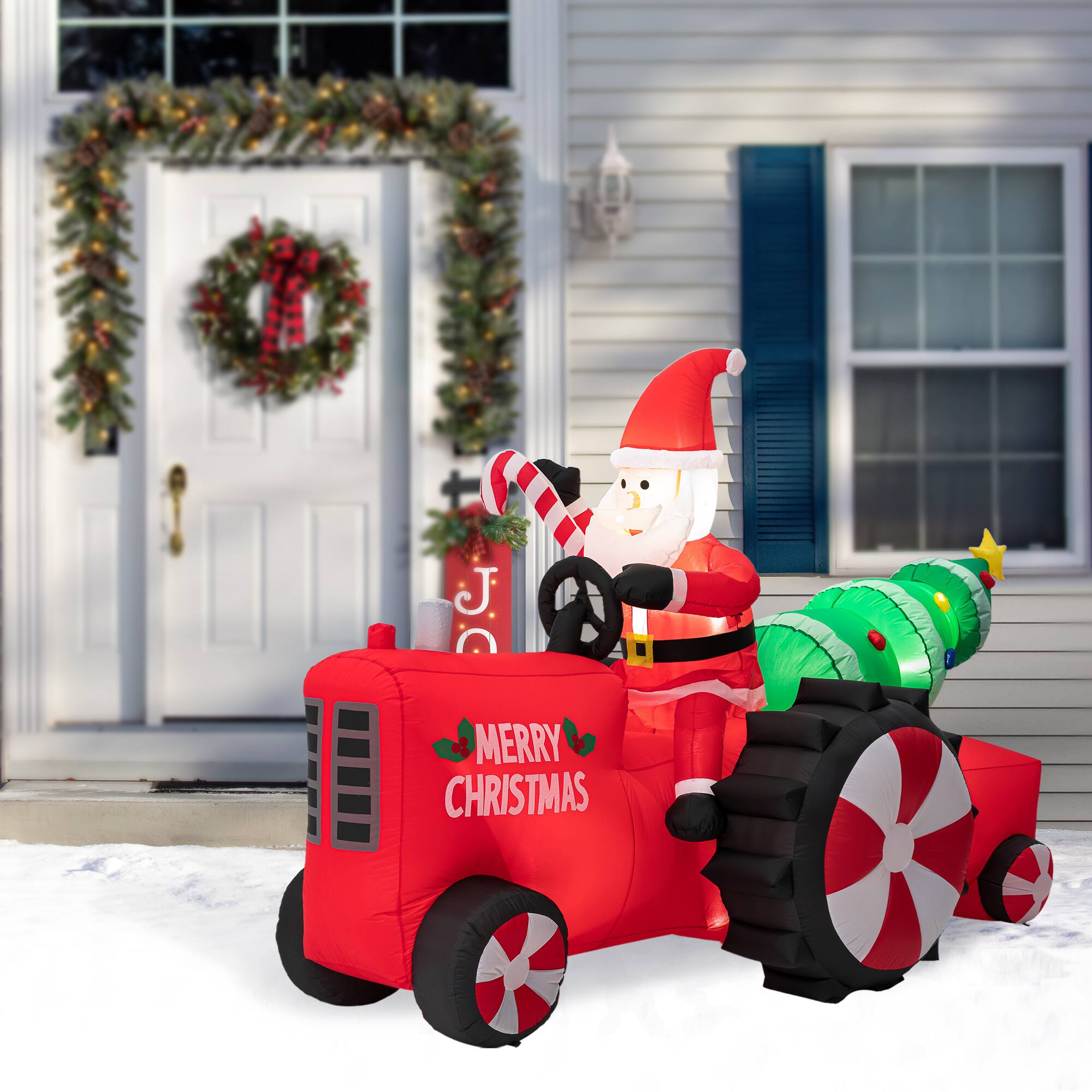 Glitzhome&#xAE; 11ft. Lighted Inflatable Santa on Tractor D&#xE9;cor