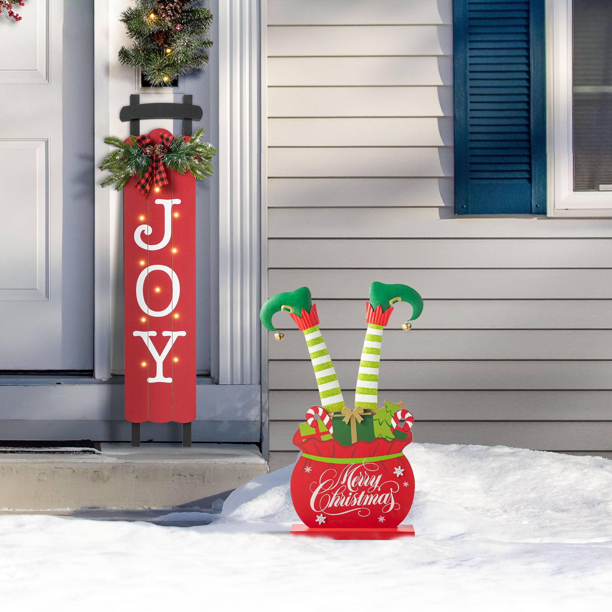 Glitzhome® 2ft. Wood & Metal Elf Legs in Gift Box Porch Décor