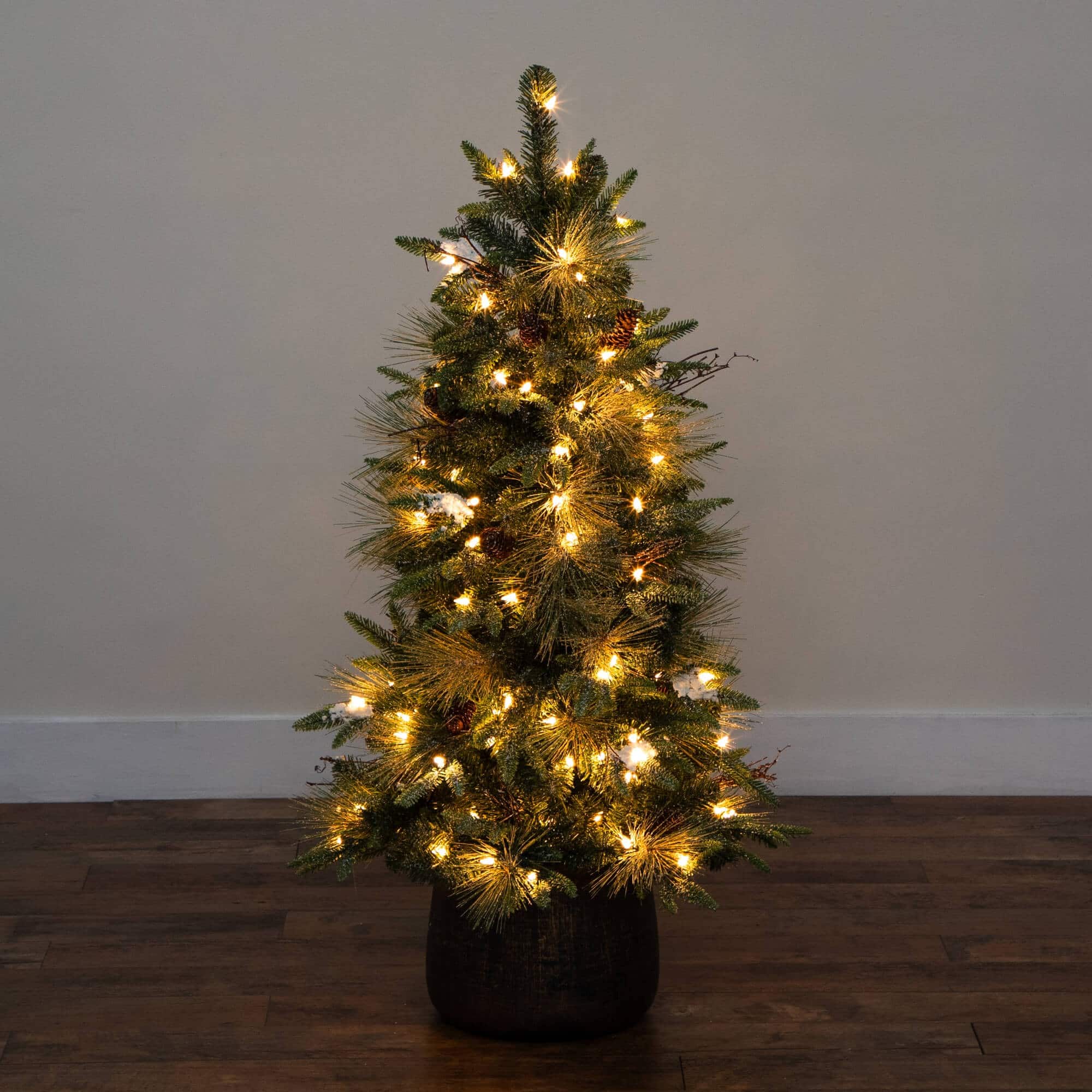 4ft. Pre-Lit Mixed Pine Snowed Artificial Christmas Tree with Pinecones in Decorative Planter, Warm White LED Lights