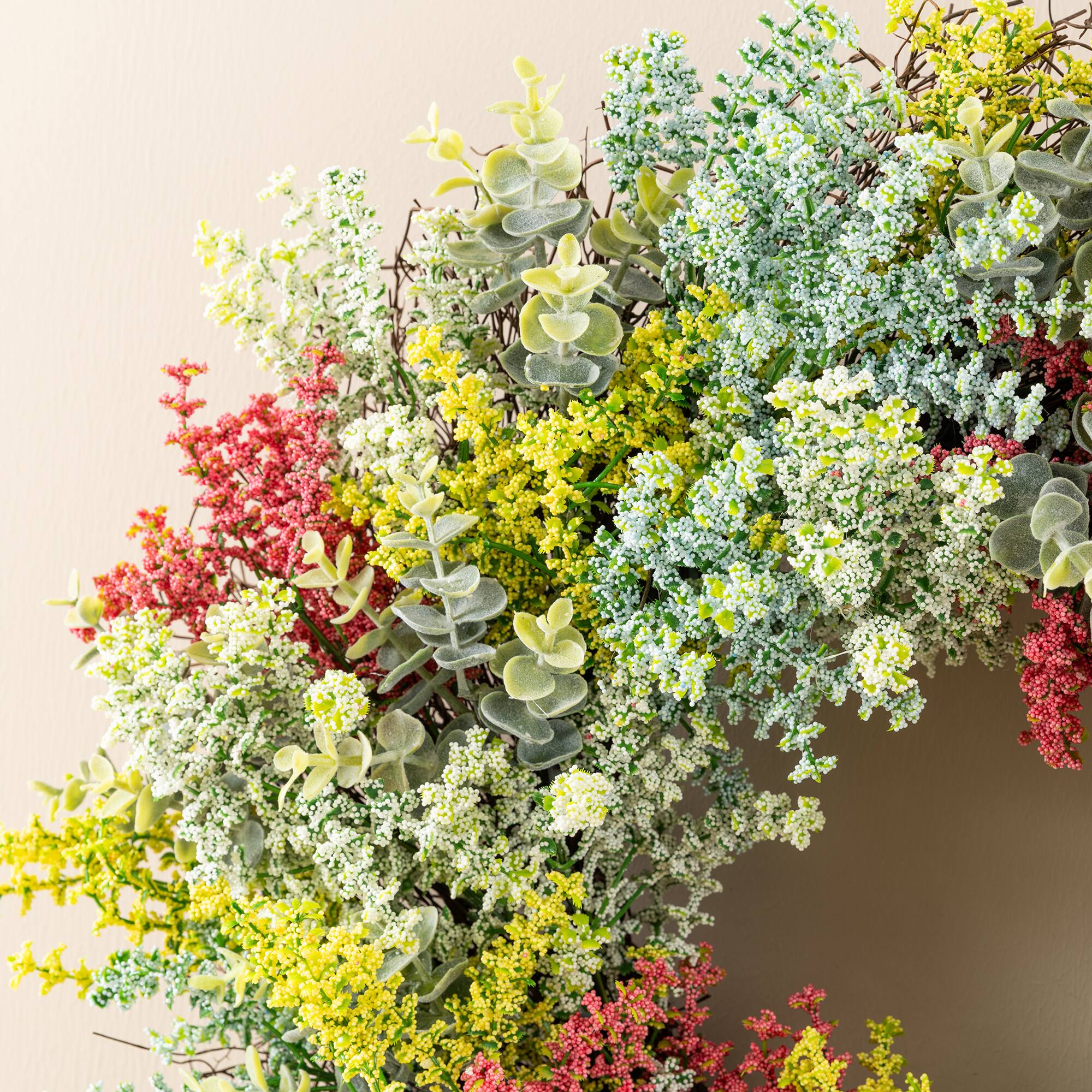 Glitzhome® 24" Mixed Floral Eucalyptus Wreath with Black Metal Hanger