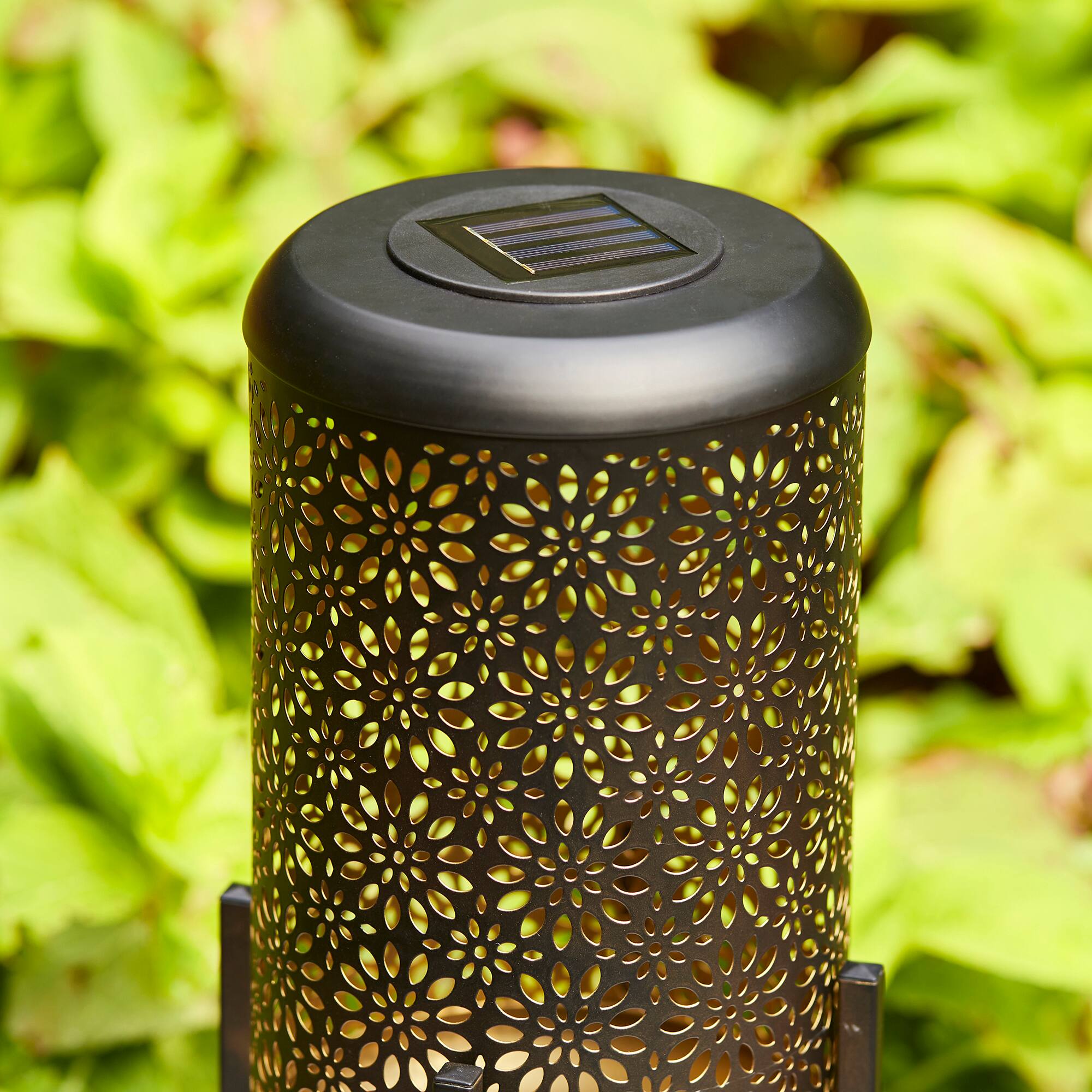 Glitzhome&#xAE; 14.25&#x22; Black Metal Cutout Flower Pattern Solar Powered LED Outdoor Lanterns, 2ct.