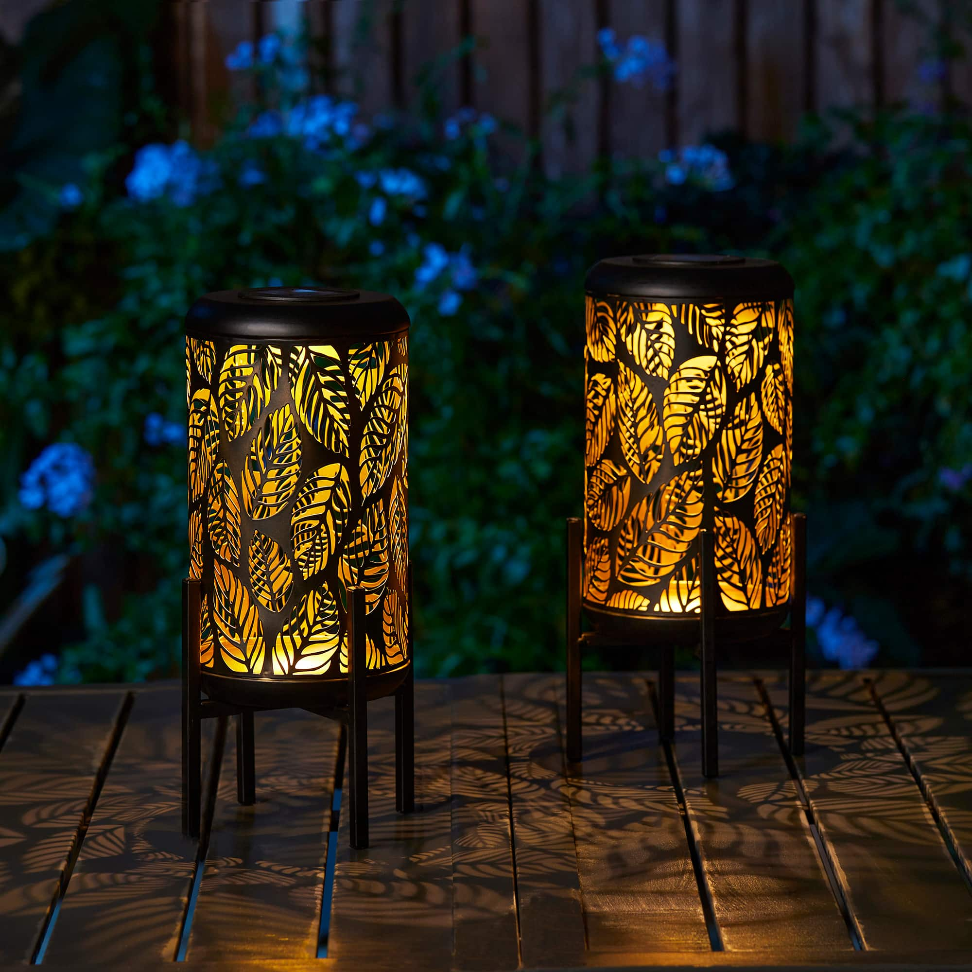 Glitzhome&#xAE; 14.25&#x22; Black Metal Cutout Leaves Pattern Solar Powered LED Outdoor Lantern, 2ct.