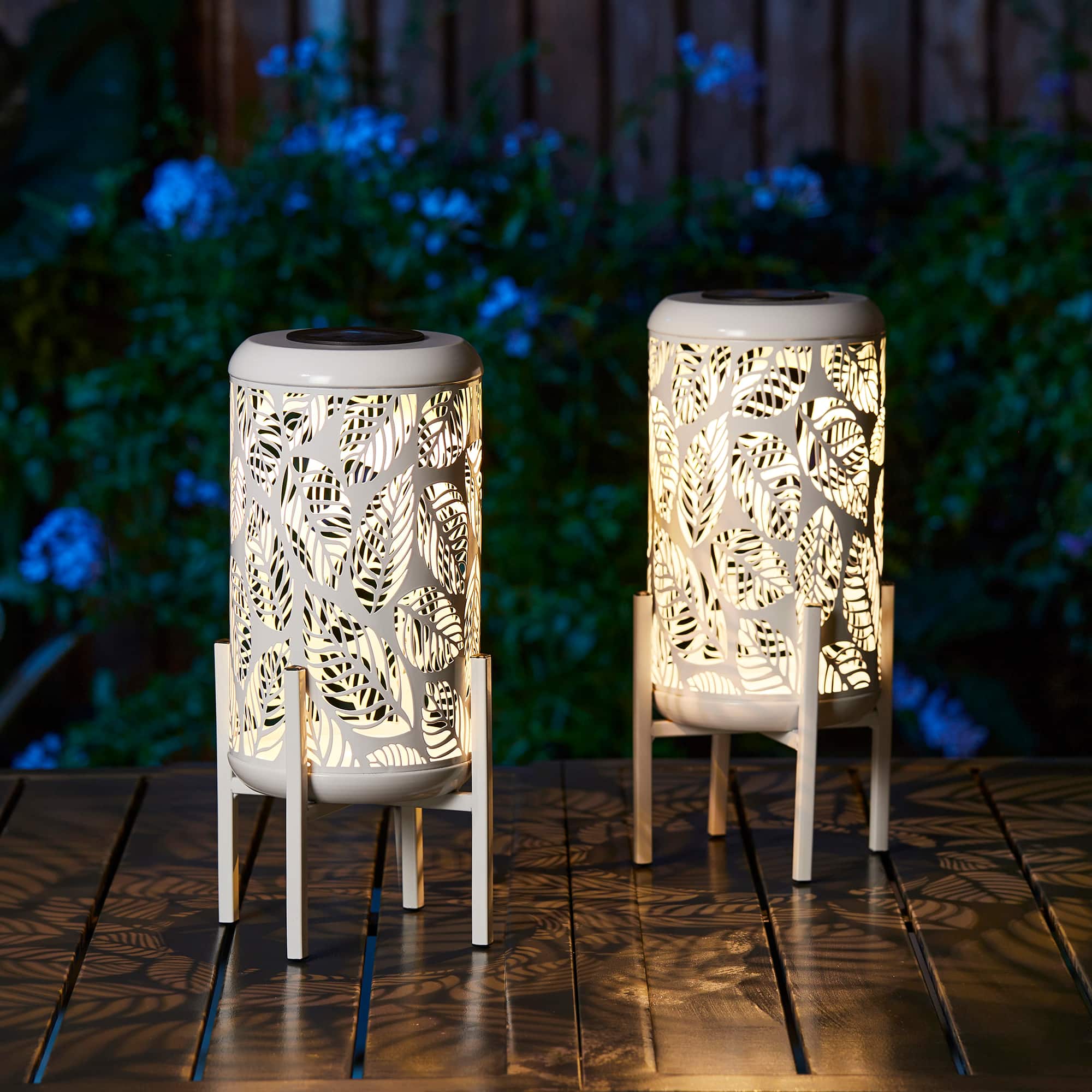 Glitzhome&#xAE; 14.25&#x22; White Metal Cutout Leaves Pattern Solar Powered LED Outdoor Lanterns, 2ct.