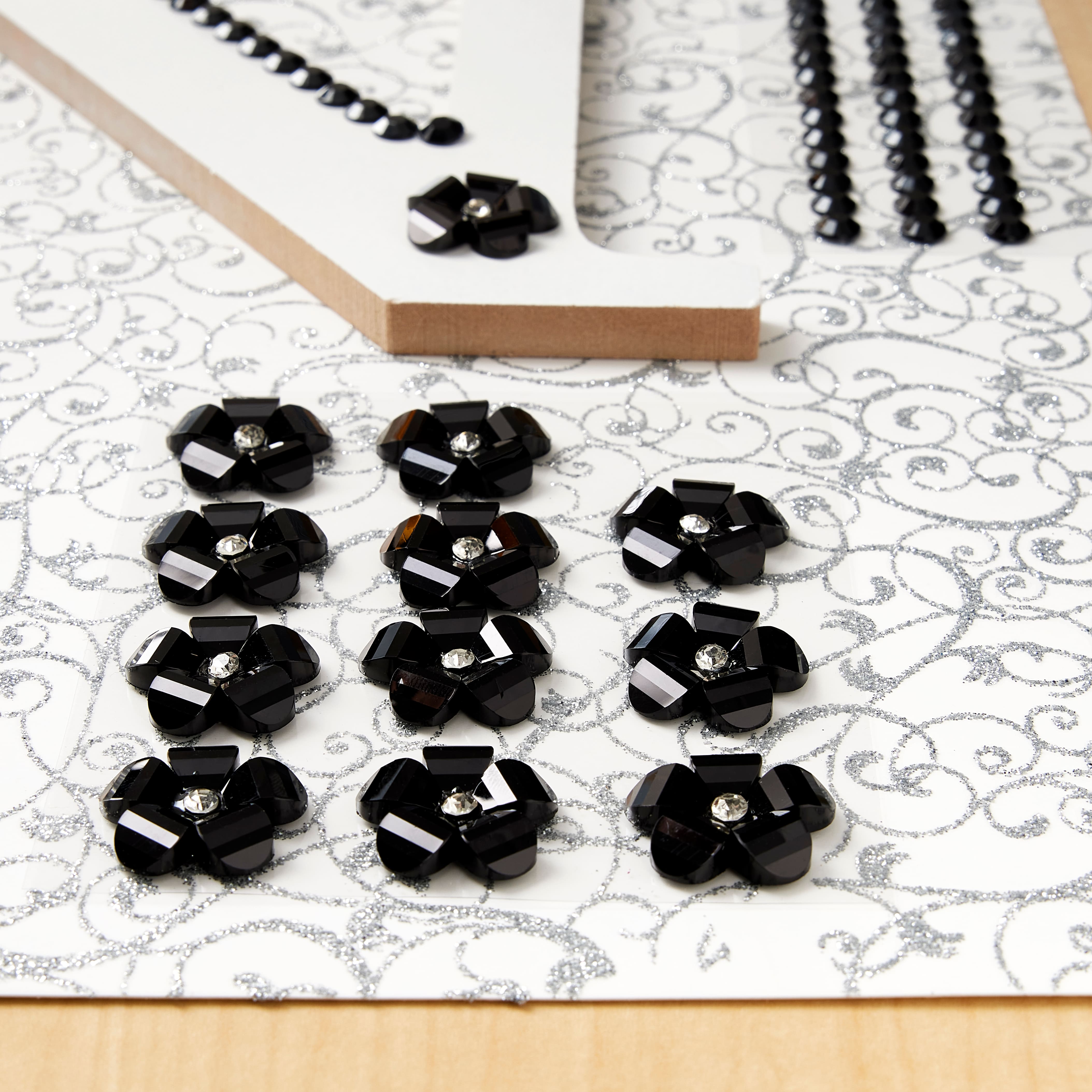 12 Packs: 12 ct. (144 total) Black Rhinestone Flowers by Recollections™