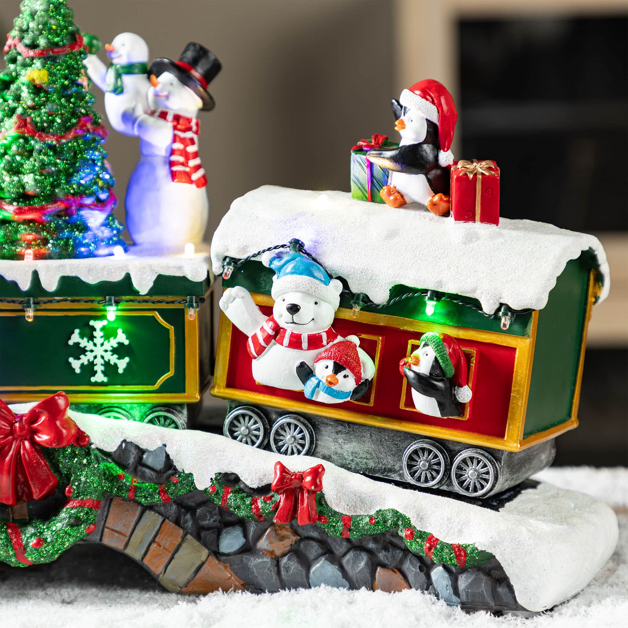 Glitzhome® 20" Lighted Christmas Santa Train Resin Village with Movement and Music