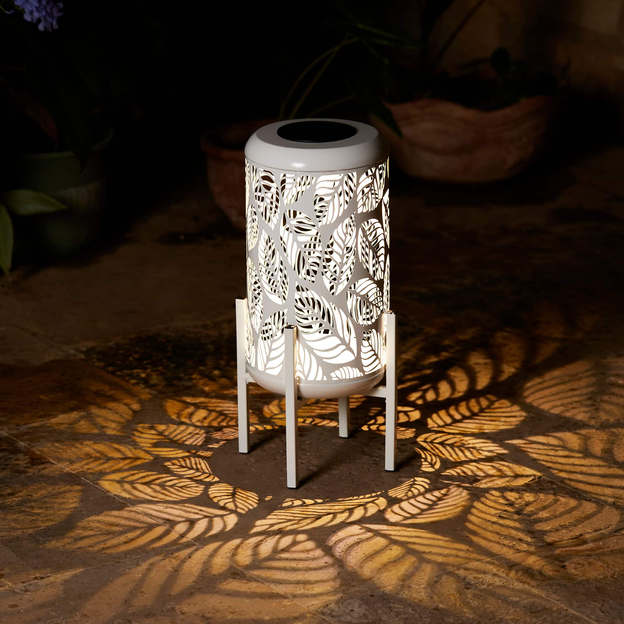 Glitzhome&#xAE; 14.25&#x22; White Metal Cutout Leaves Pattern Solar Powered LED Outdoor Lantern