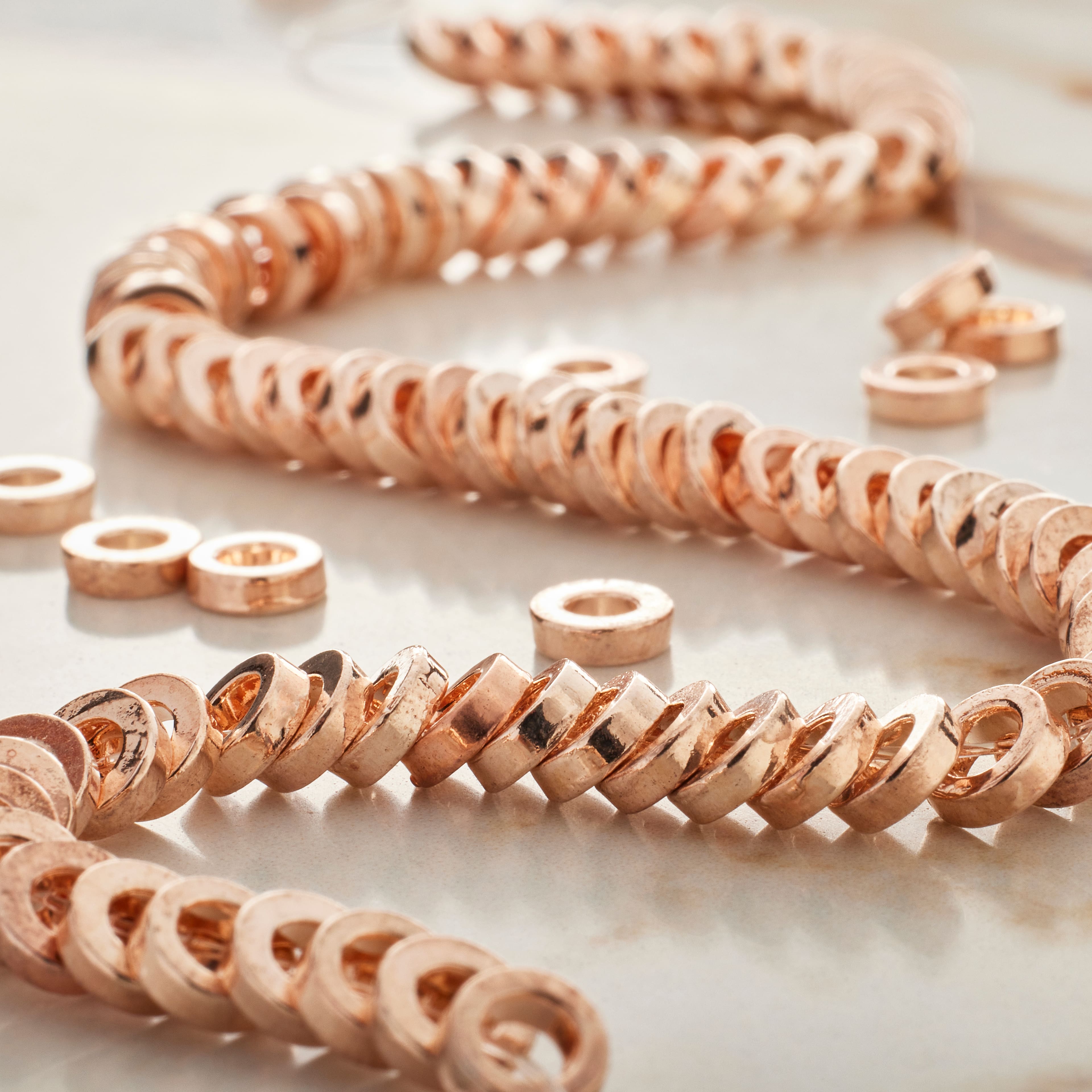 12 Pack: Rose Gold Large Hole Metal Spacer Disc Beads by Bead Landing&#x2122;