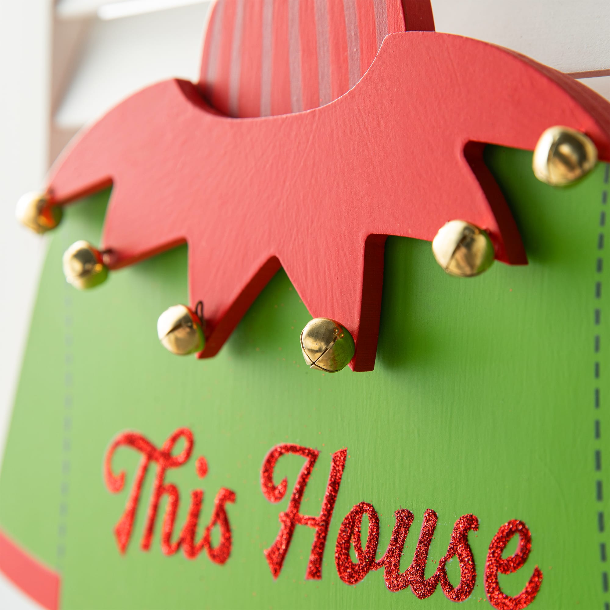 Glitzhome® 13.25" Christmas Elf Sweater Sign Door Hanger