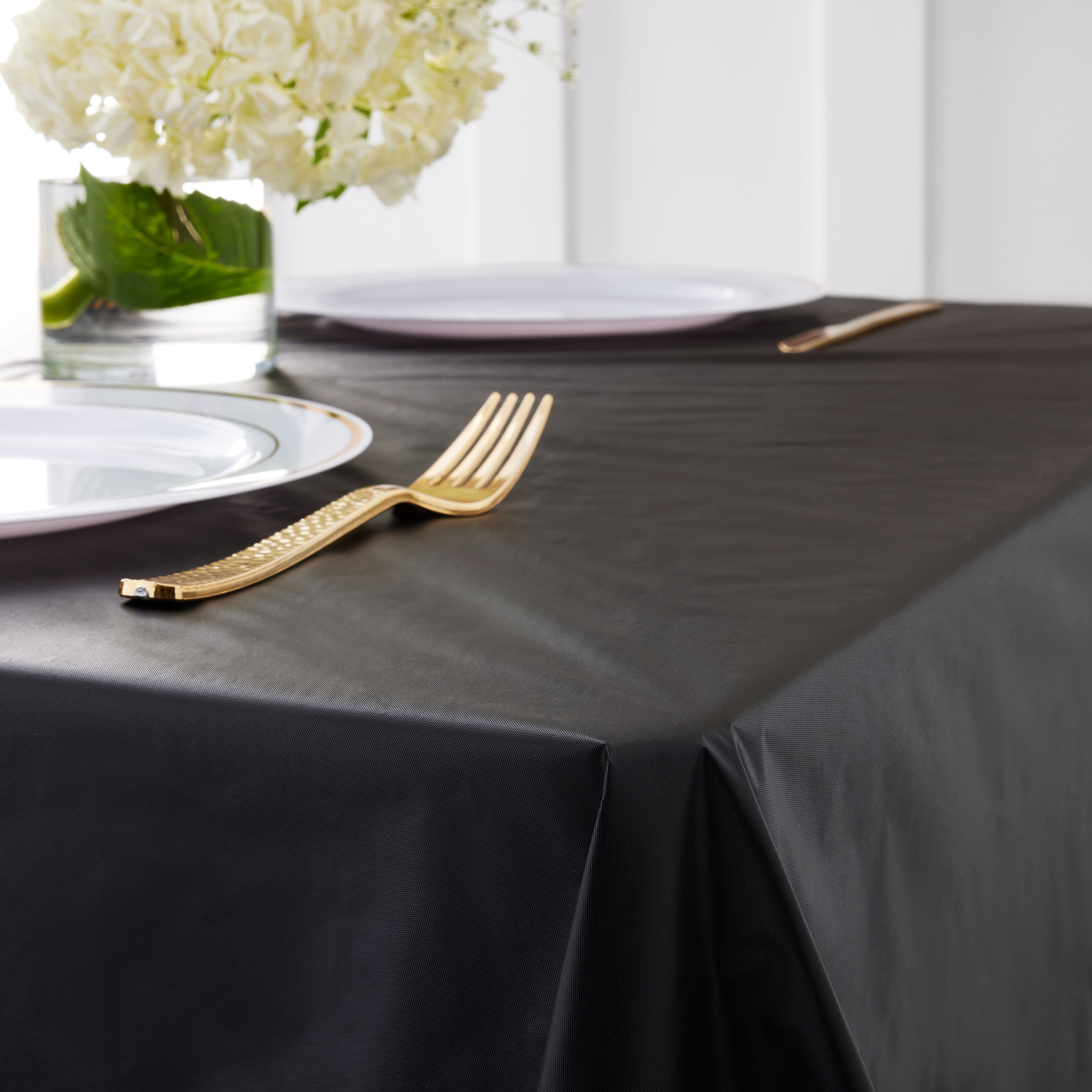 12 Pack: 100ft. Black Plastic Table Cover Roll by Celebrate It&#x2122;