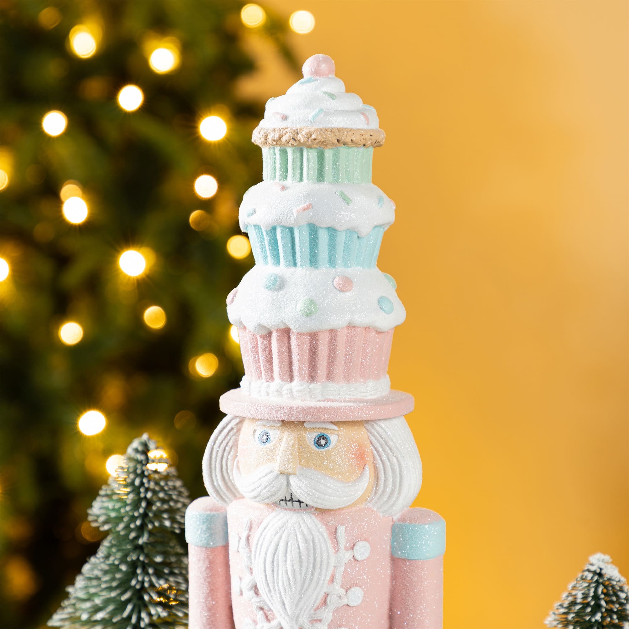 Glitzhome&#xAE; 18.25&#x22; Resin Christmas Cupcake Nutcracker Table Decor