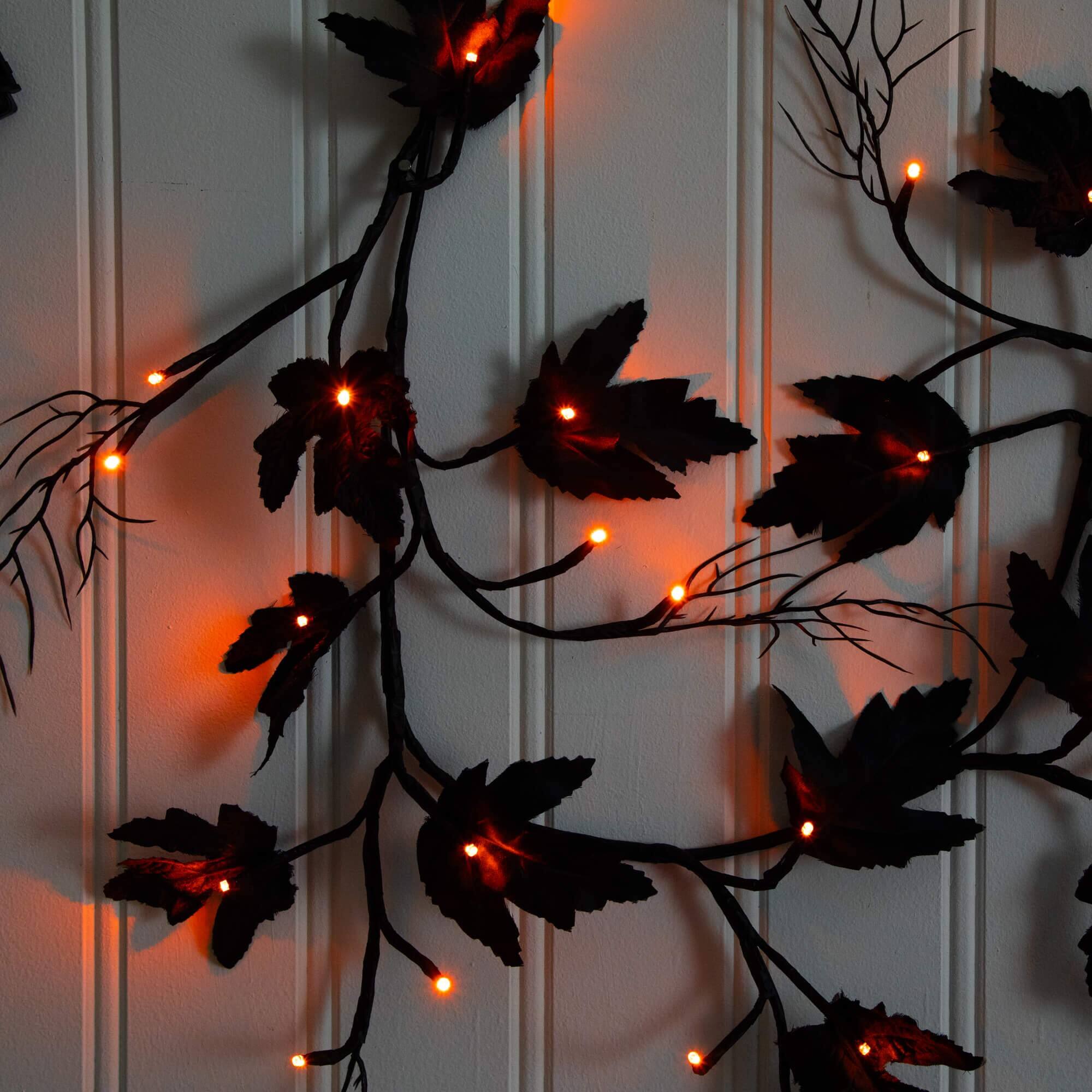 6.5ft. Pre-Lit Artificial Halloween Black Maple Garland with 48 Orange & Purple LED Lights