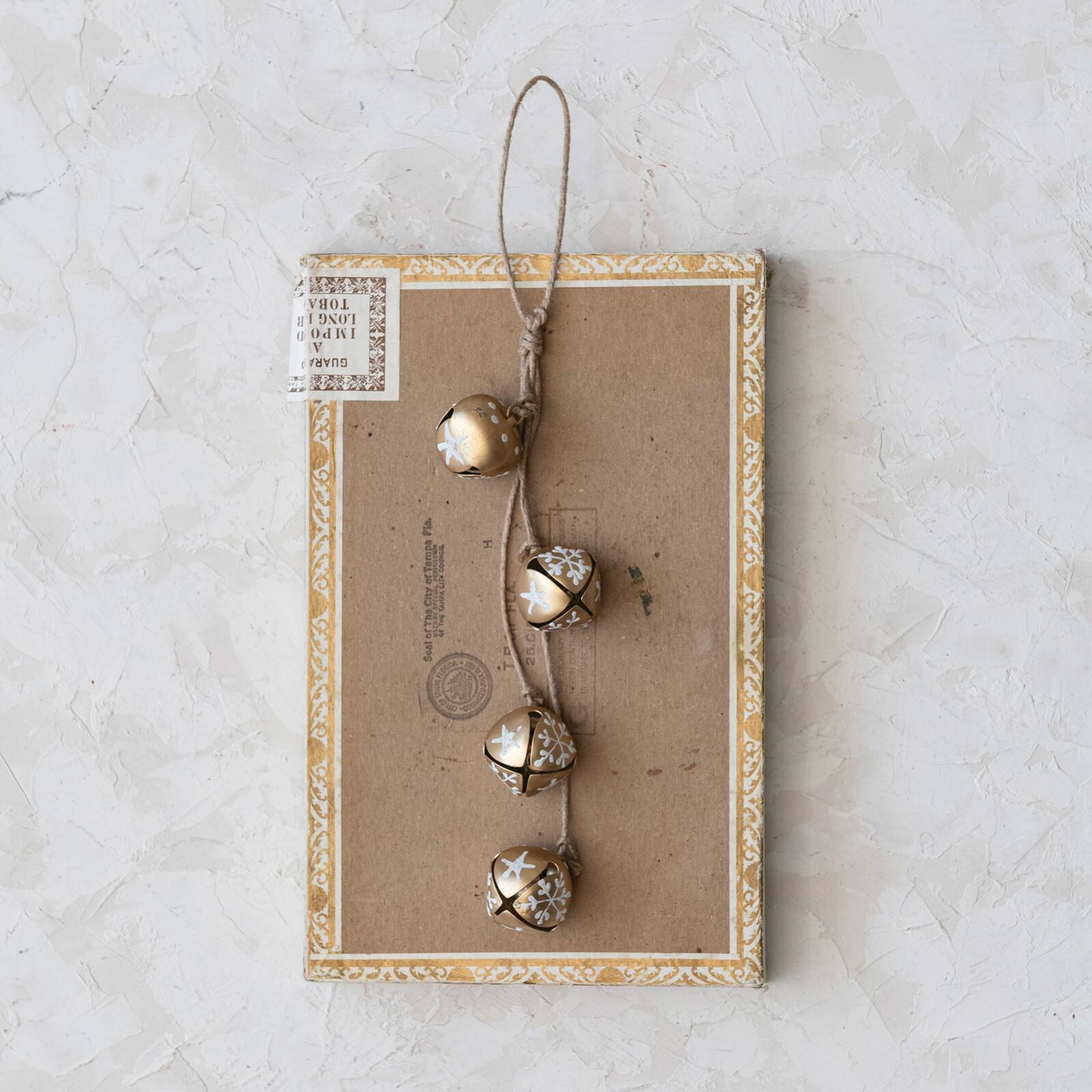 Hello Honey&#xAE; 9&#x22; Hanging Metal Jingle Bells with Hand-Painted Stars &#x26; Snowflakes on Jute Rope Hanger