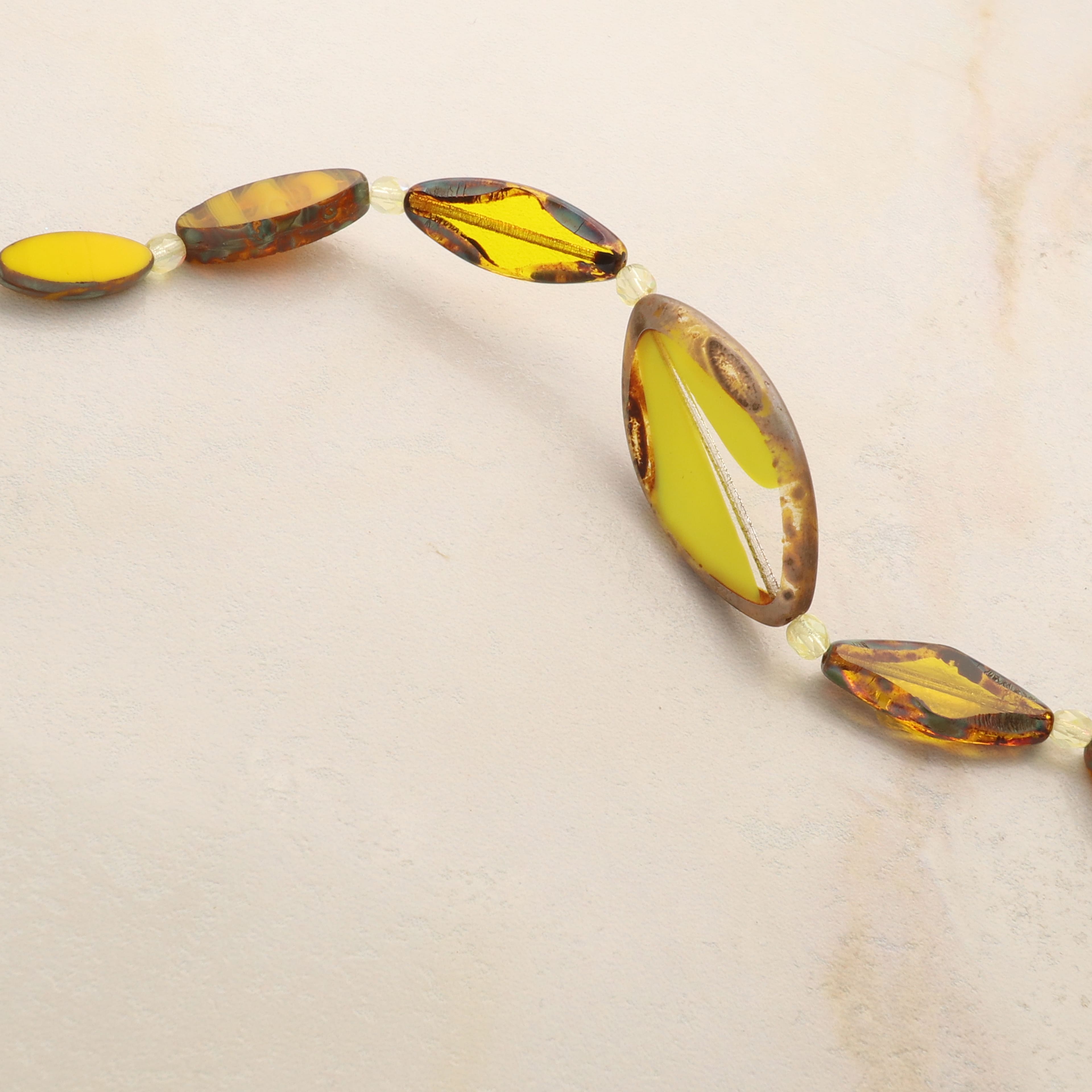 6 Packs: 13 ct. (78 total) Smooth Yellow Czech Glass Oval Bead Mix by Bead Landing™