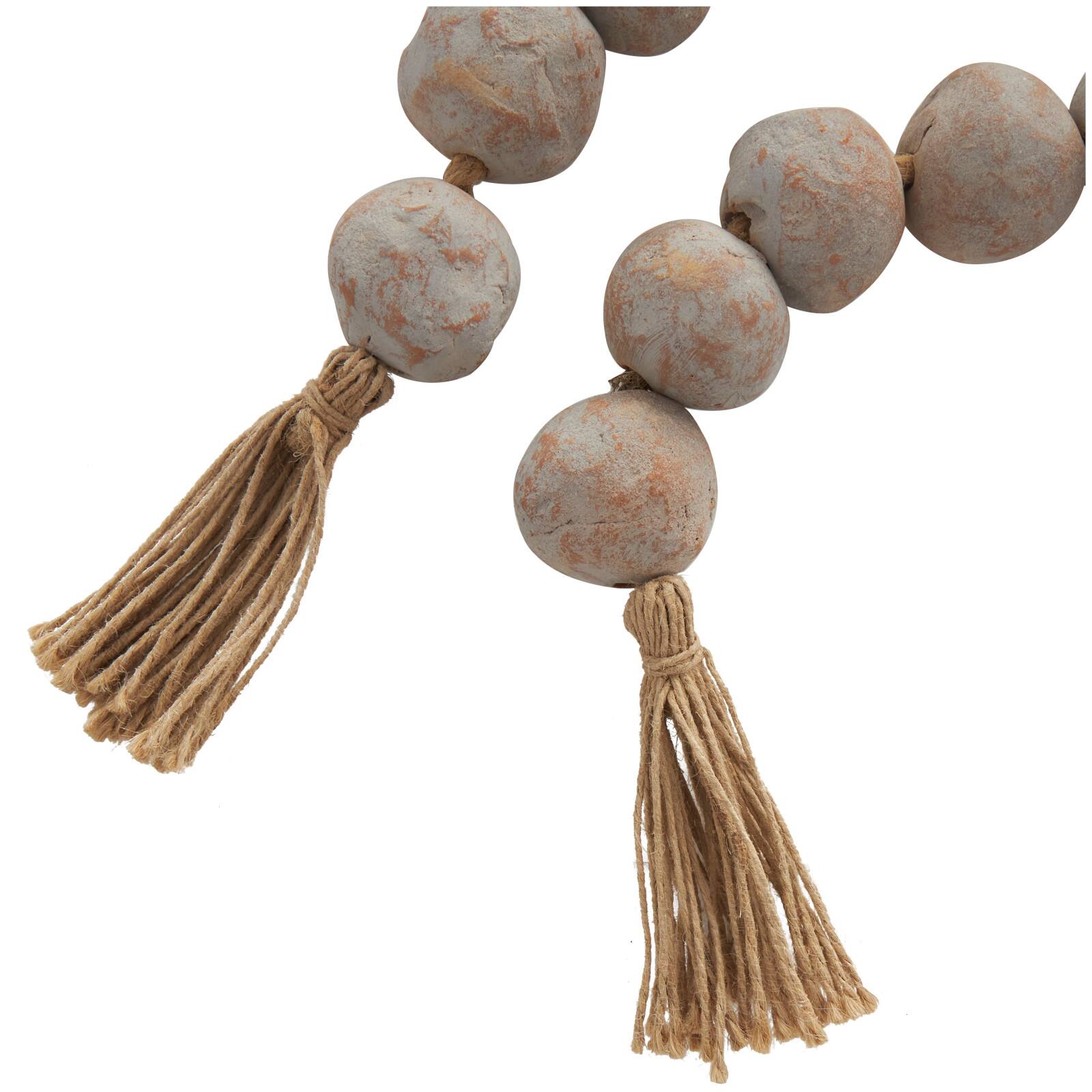 5ft. Paper Mache Round Distressed Beaded Garland with Tassel