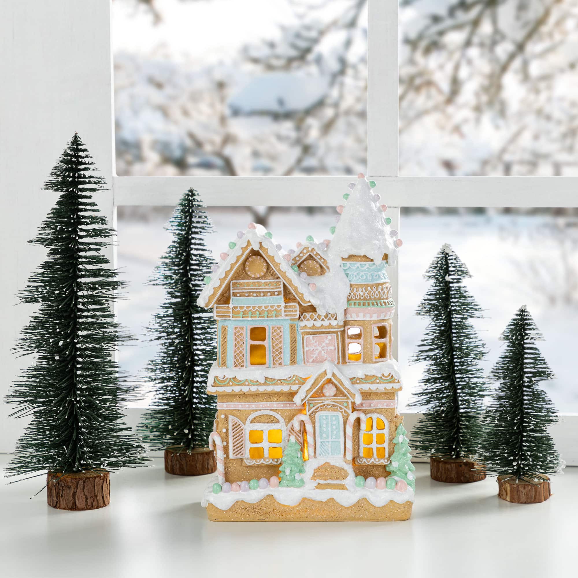 Glitzhome&#xAE; 11.75&#x22; Christmas Macaron Resin Village Table Decor