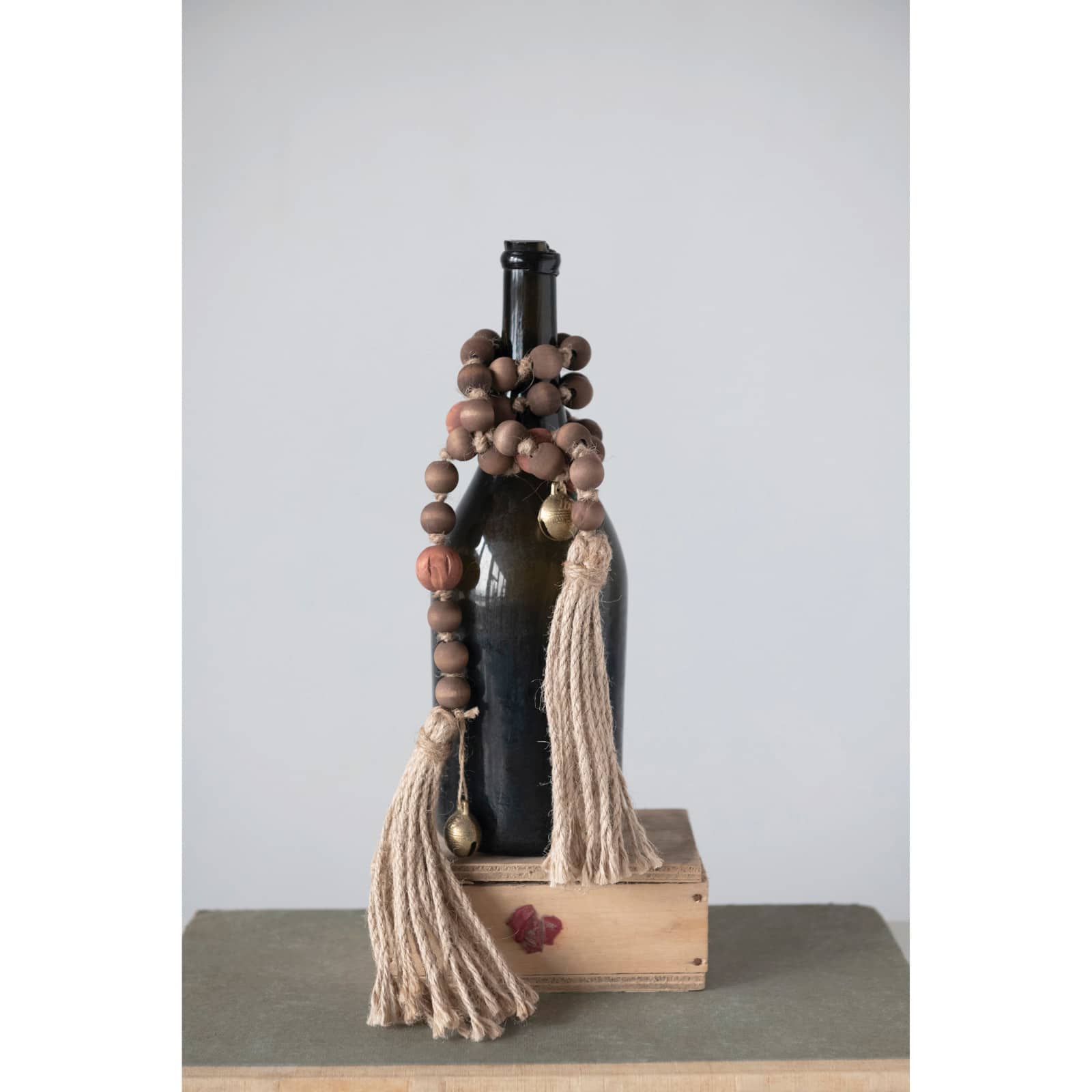 Hello Honey&#xAE; 40&#x22; Paulownia Wood Beads, Jingle Bells &#x26; Jute Tassels Garland