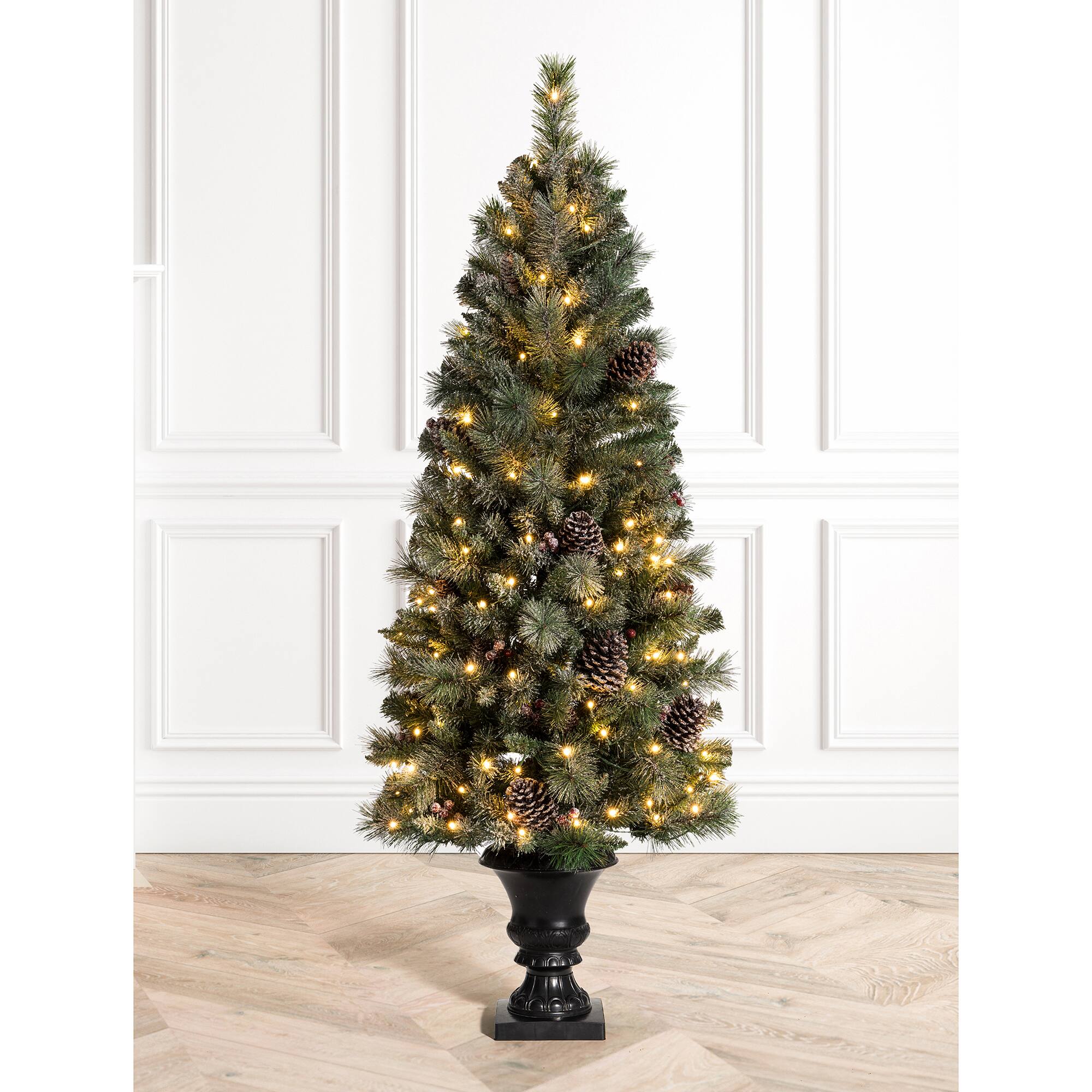 5ft. Pre-Lit Flocked Pine Artificial Christmas Tree in Black Urn, Warm White Lights
