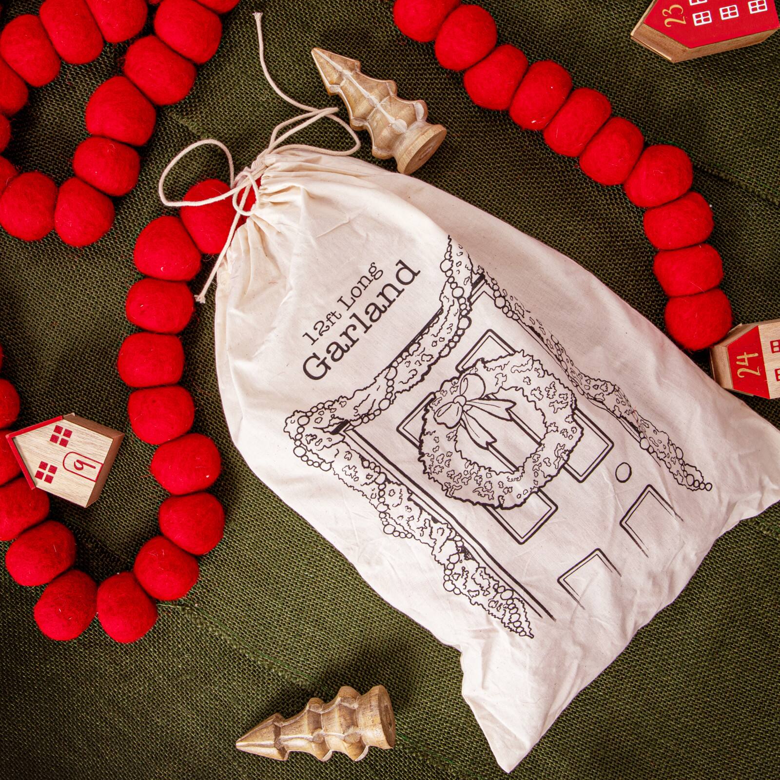 Hello Honey&#xAE; 12ft. Handmade Wool Felt Ball Garland in Printed Drawstring Bag