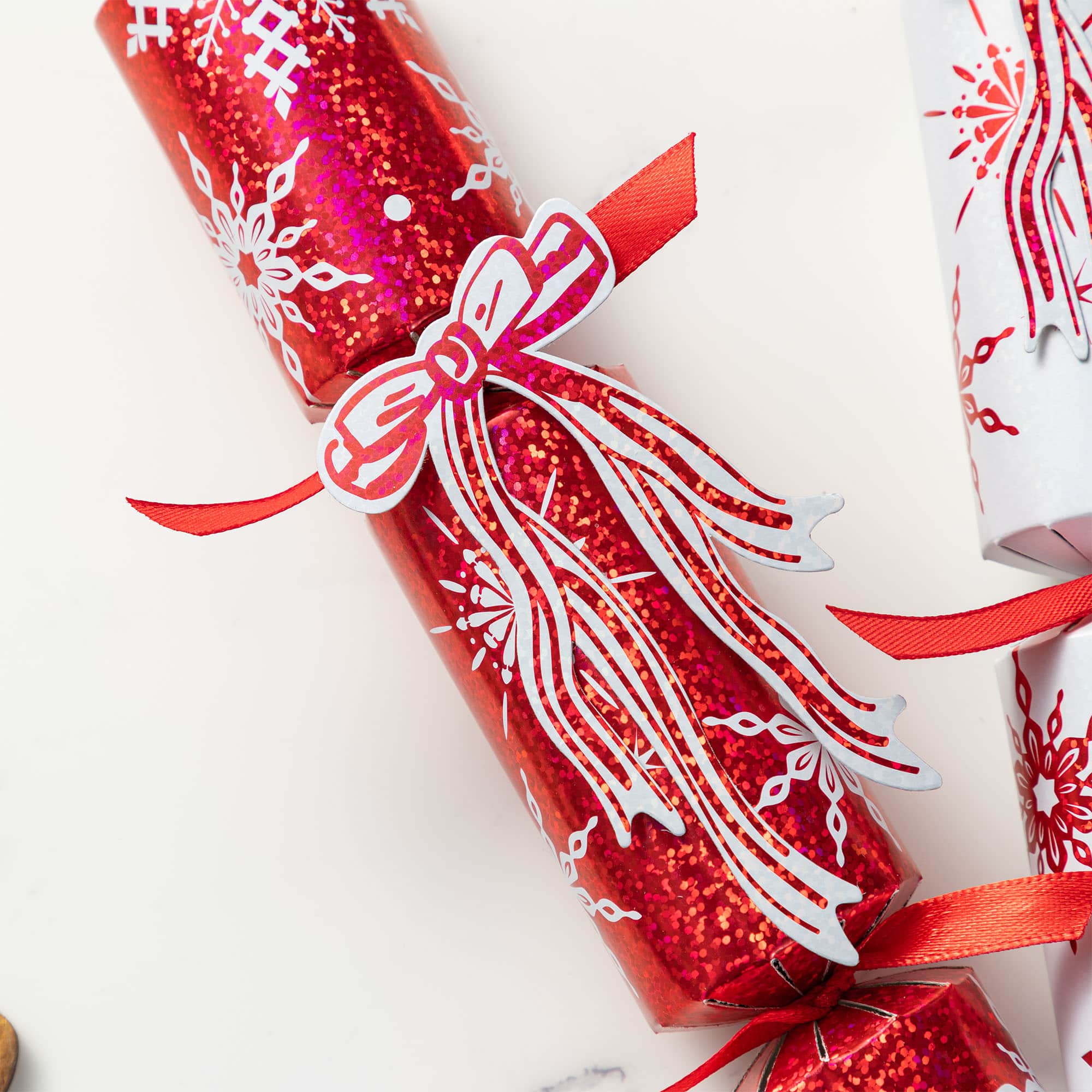 Glitzhome&#xAE; 12PK 1.25&#x22;D x 10&#x22;H Christmas Snowflake with Bow Party Cracker with Gift Contents