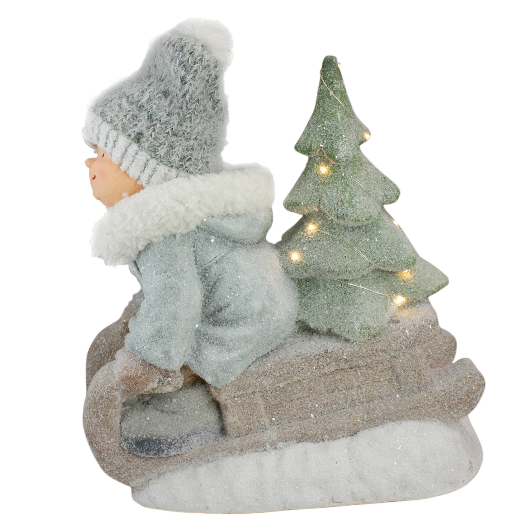 15" Beige & Green Lighted Boy on a Sled Christmas Decoration