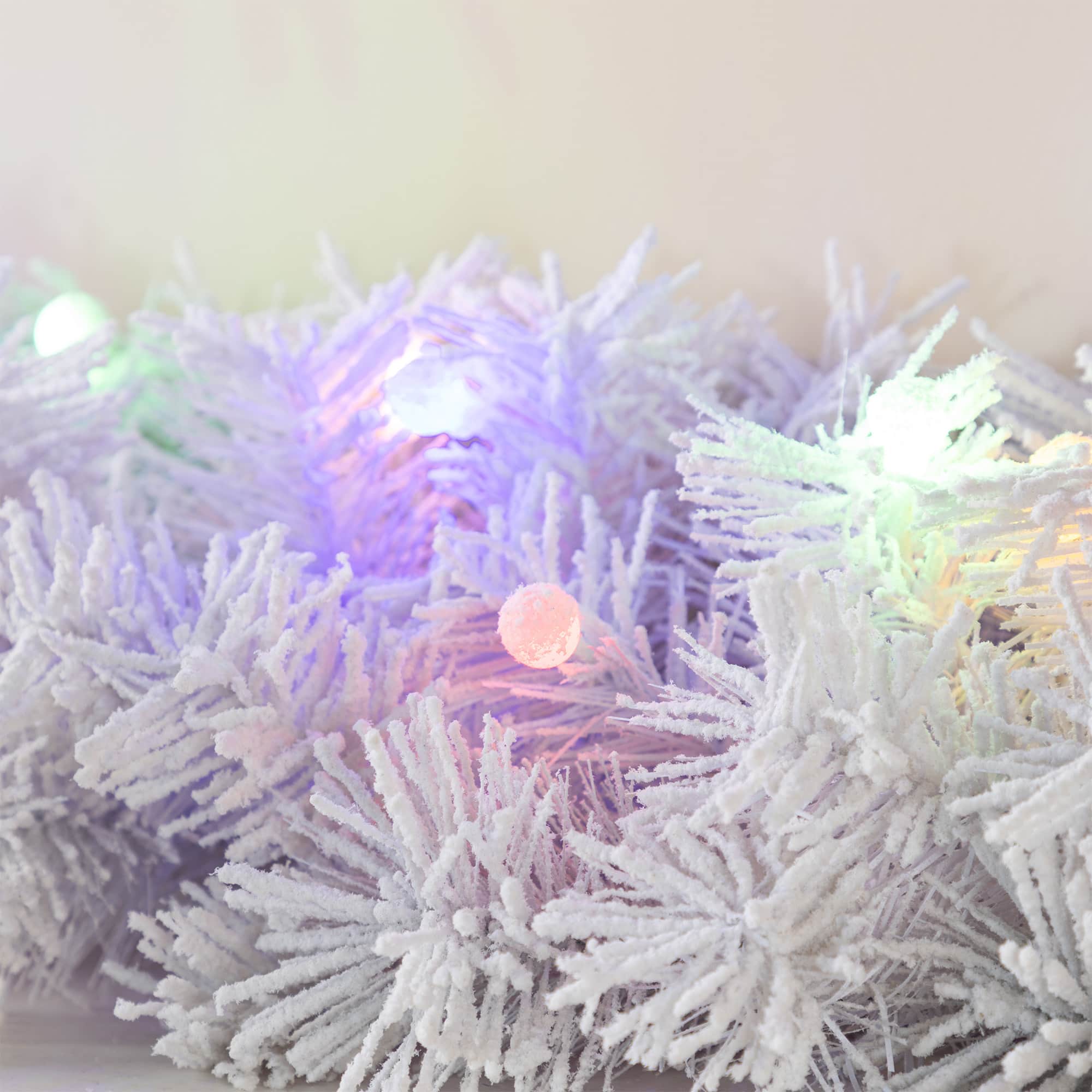 Glitzhome&#xAE; 9ft Pre-Lit Snow Flocked White Pine Christmas Garland with Timer