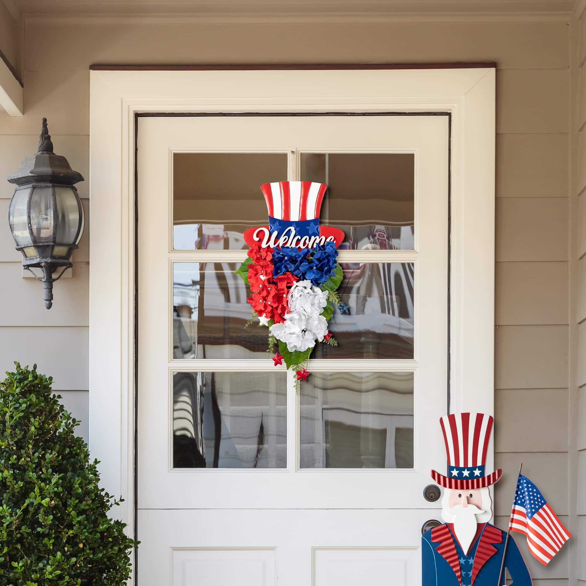 Glitzhome&#xAE; 22.5&#x22; Patriotic Americana Metal Top Hat &#x26; Hydrangea Swag Wall D&#xE9;cor