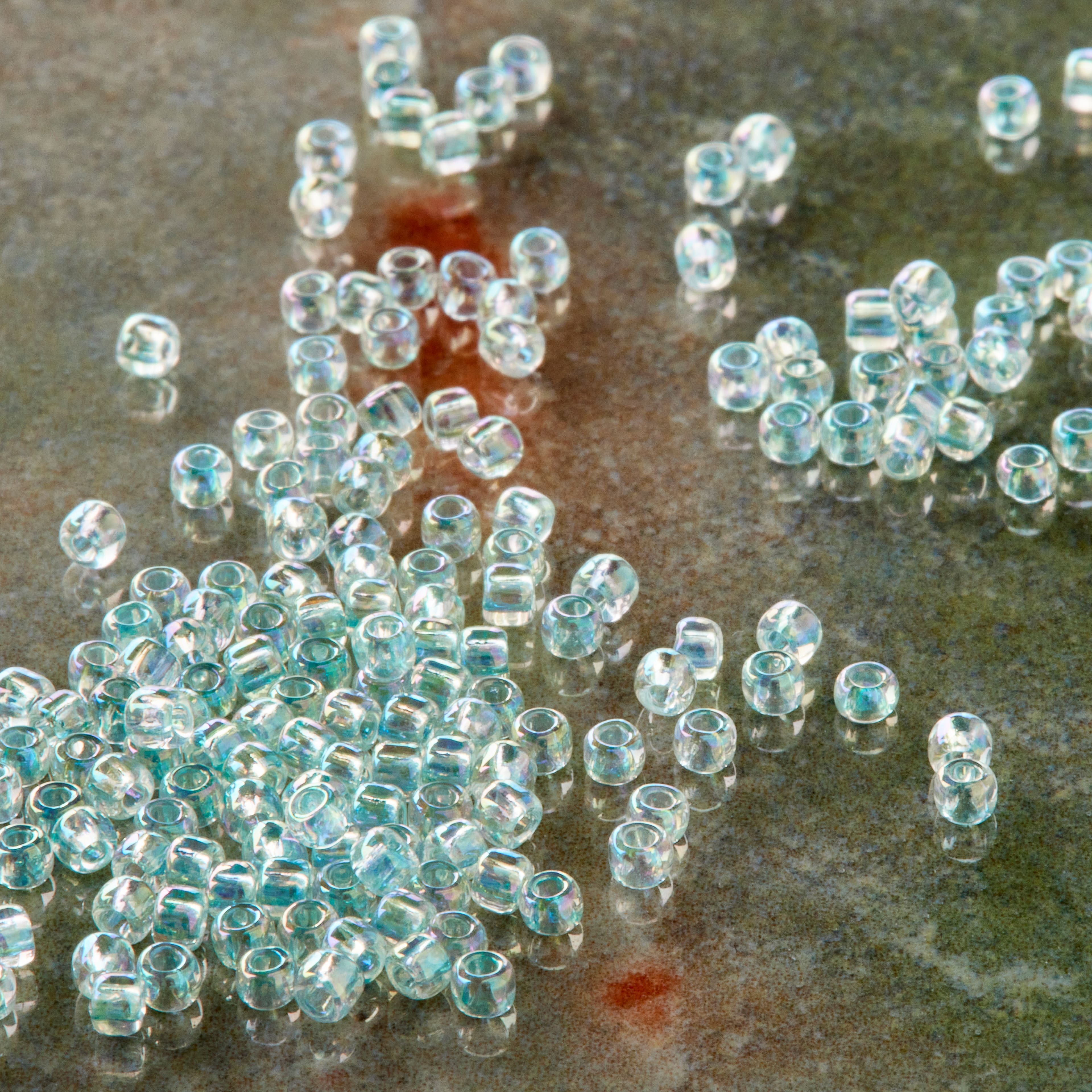 12 Pack: Toho® Iridescent Japanese Glass Seed Beads, 11/0