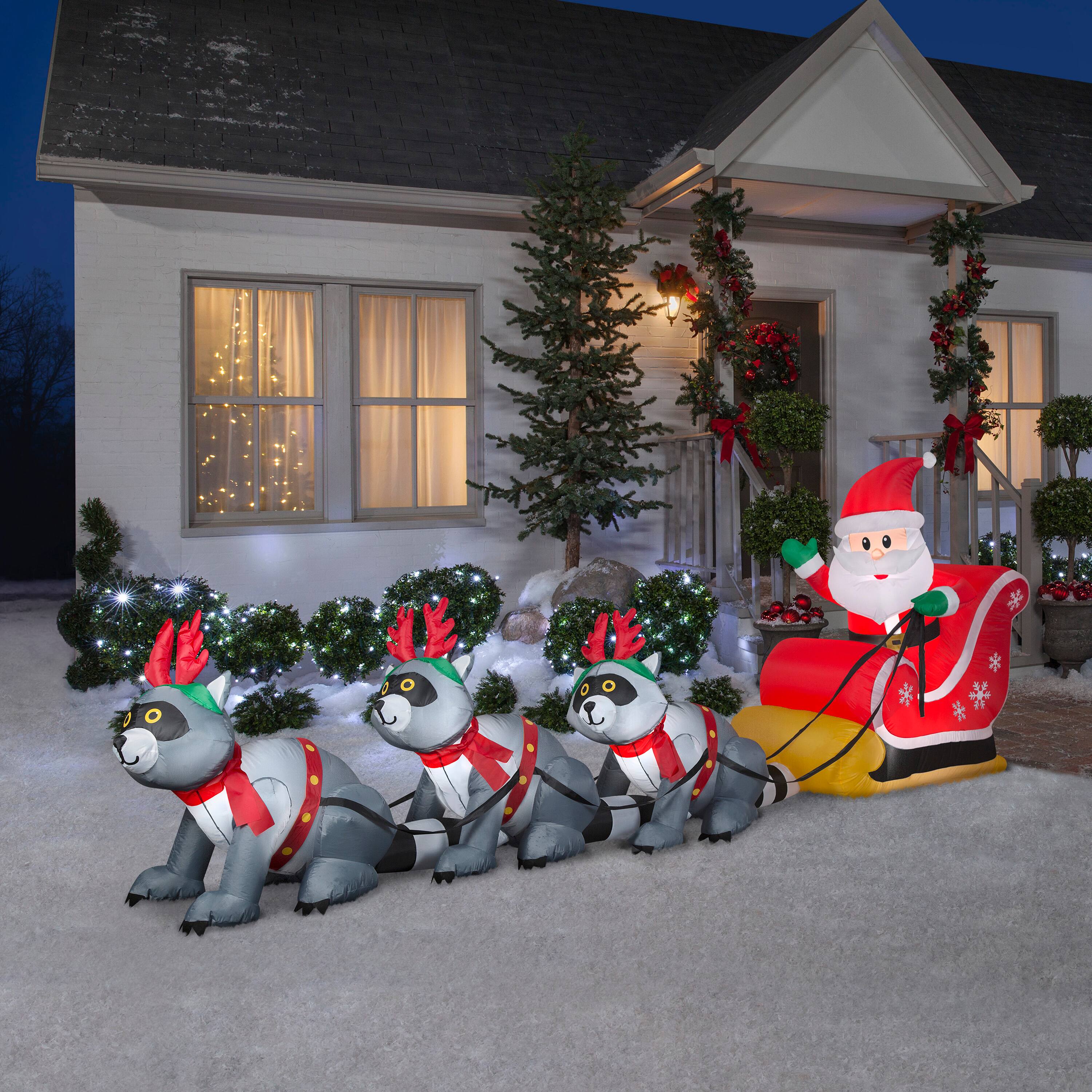 13ft. Airblown&#xAE; Inflatable Christmas Giant Santa&#x27;s Sleigh with Raccoons