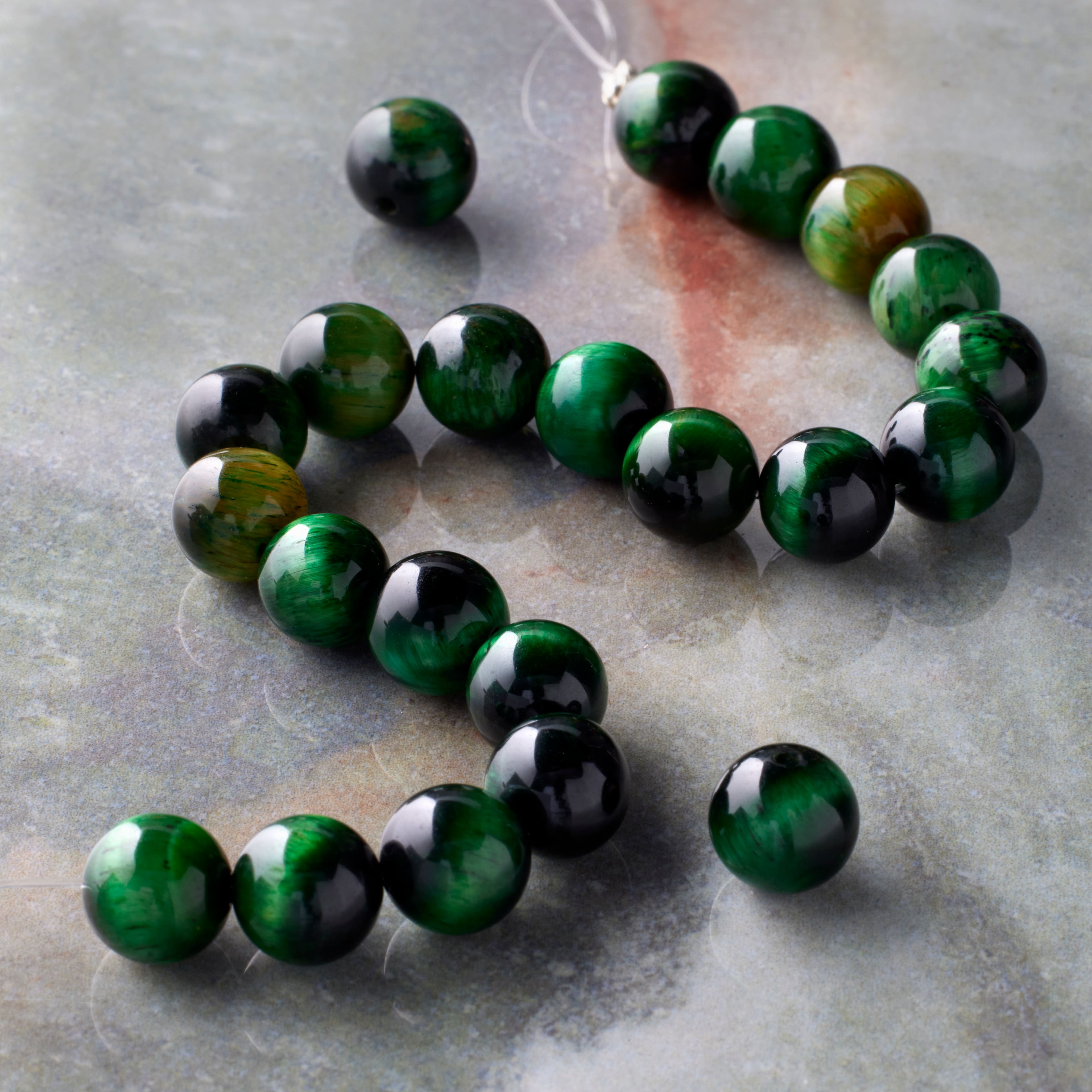 12 Packs: 22 ct. (264 total) Dark Green Dyed Tiger's Eye Round Beads, 8mm by Bead Landing™