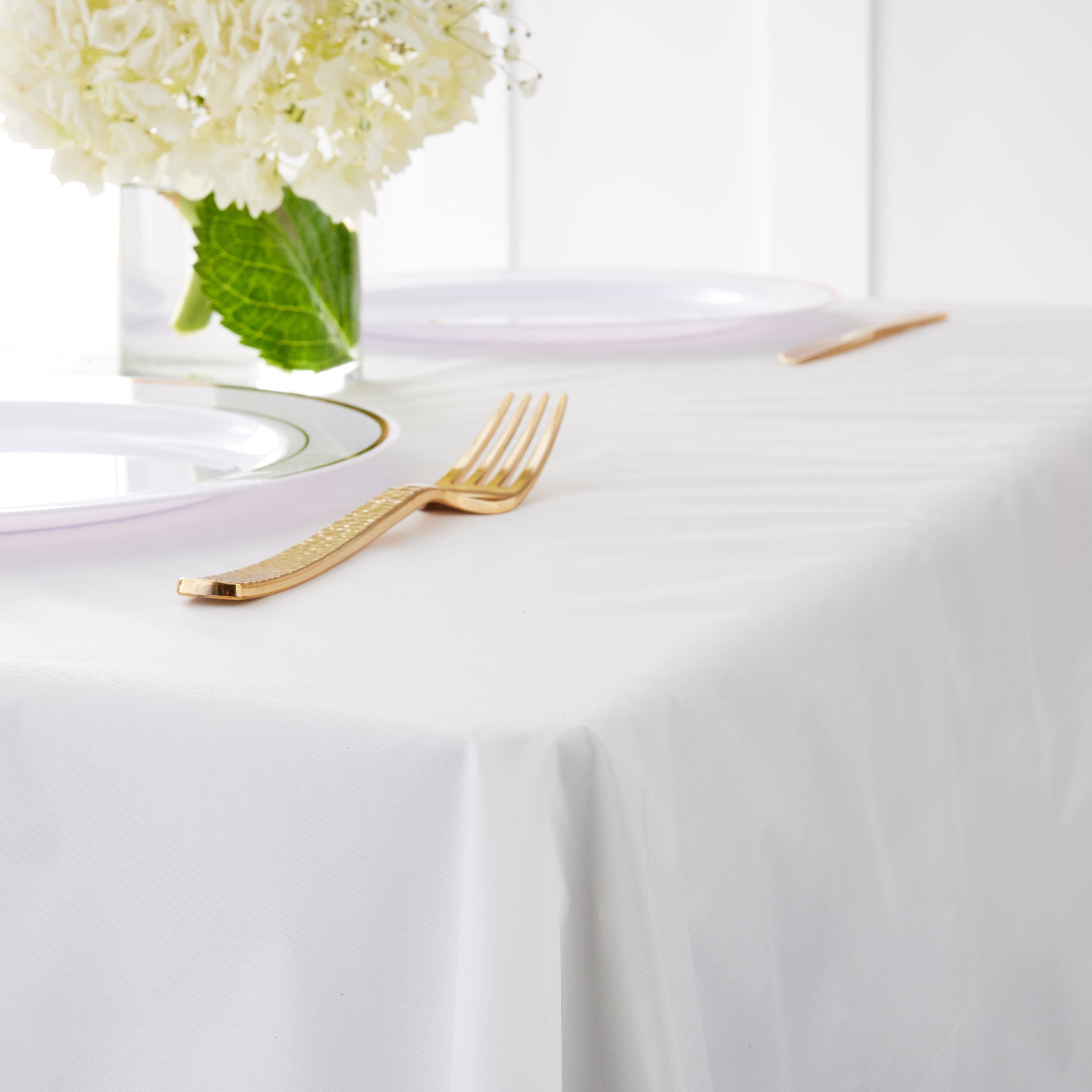 12 Pack: 100ft. White Plastic Table Cover Roll by Celebrate It&#x2122;
