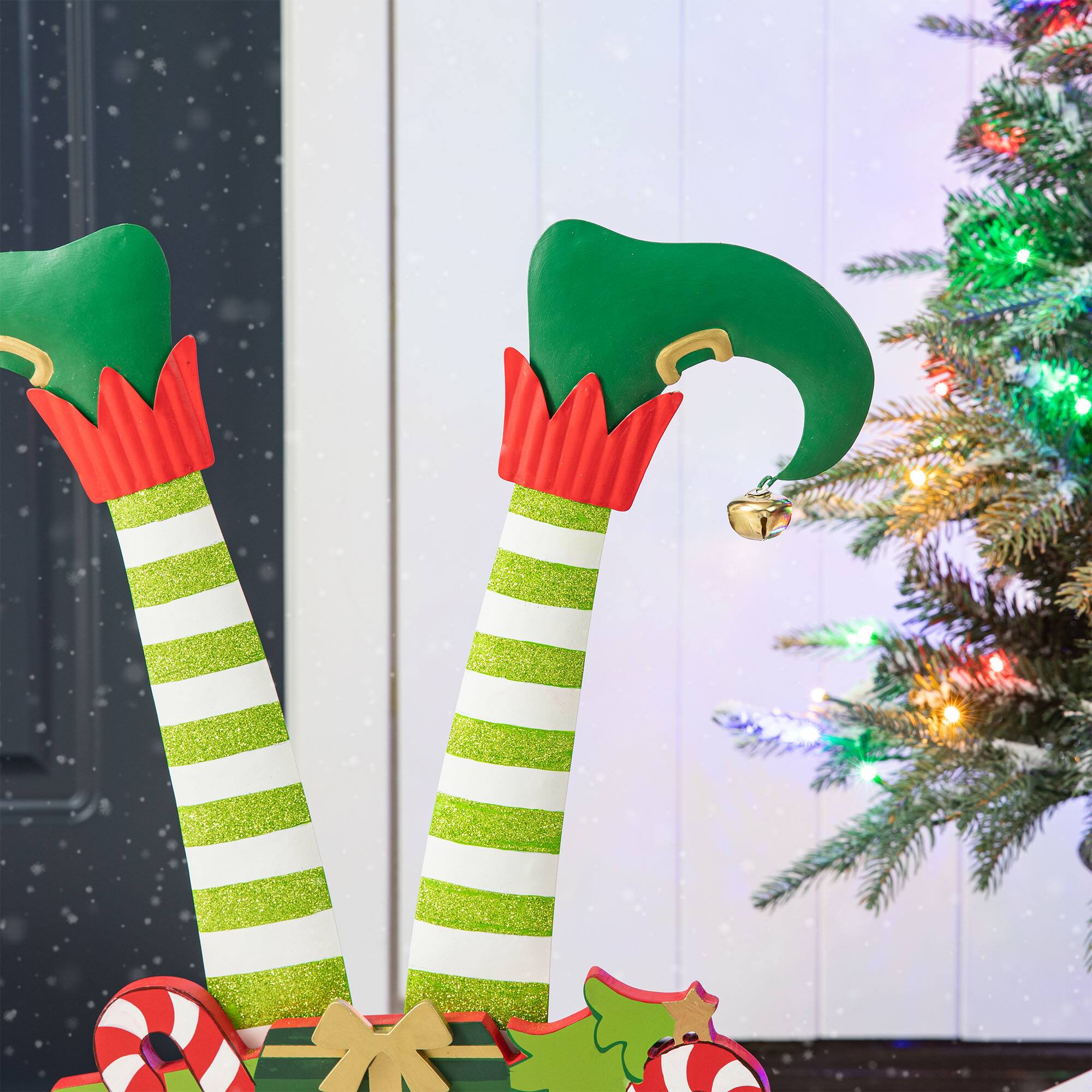Glitzhome® 2ft. Wood & Metal Elf Legs in Gift Box Porch Décor