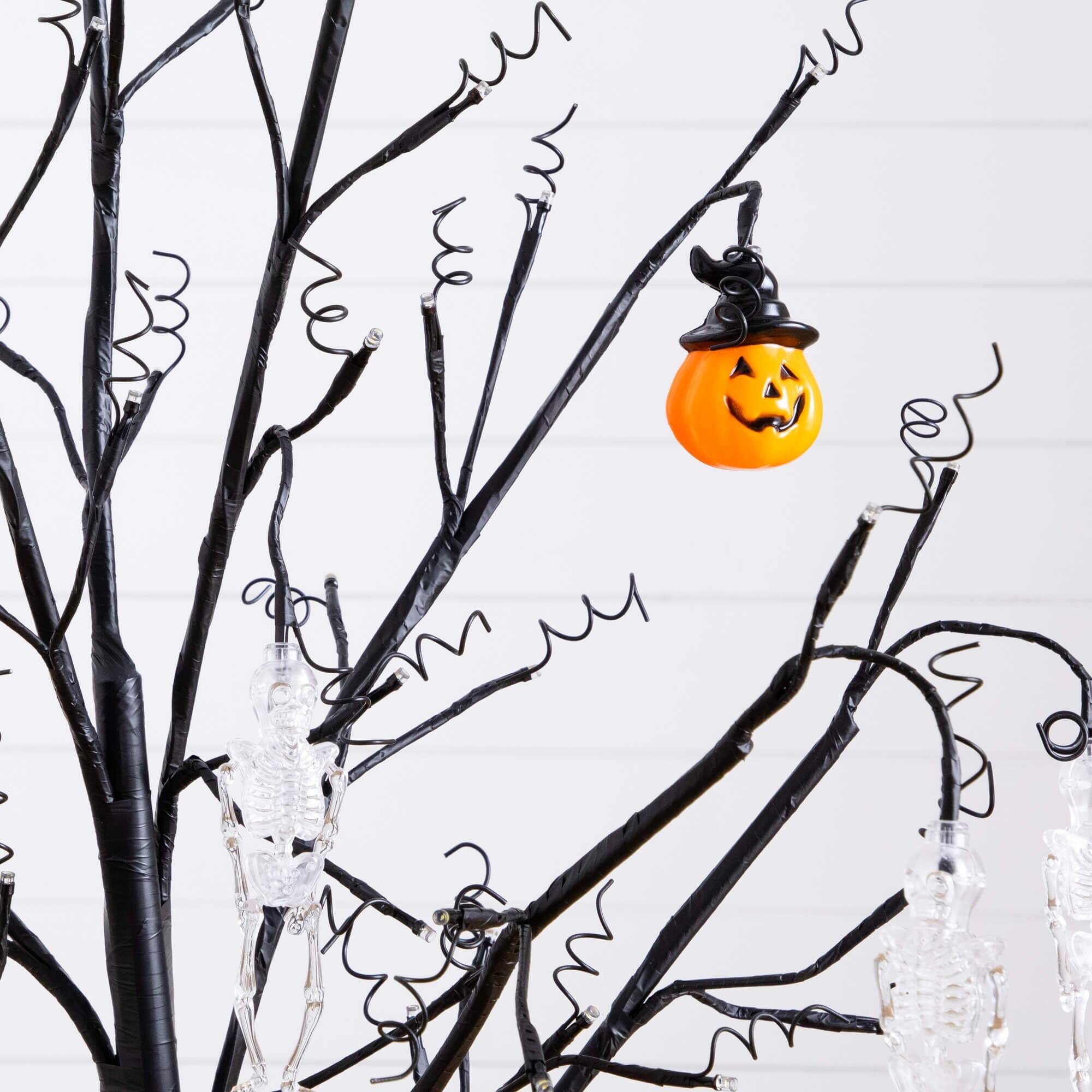 5ft. Pre-Lit Artificial Halloween Pumpkins and Skulls Ornament Tree with 72 Warm White LED Lights
