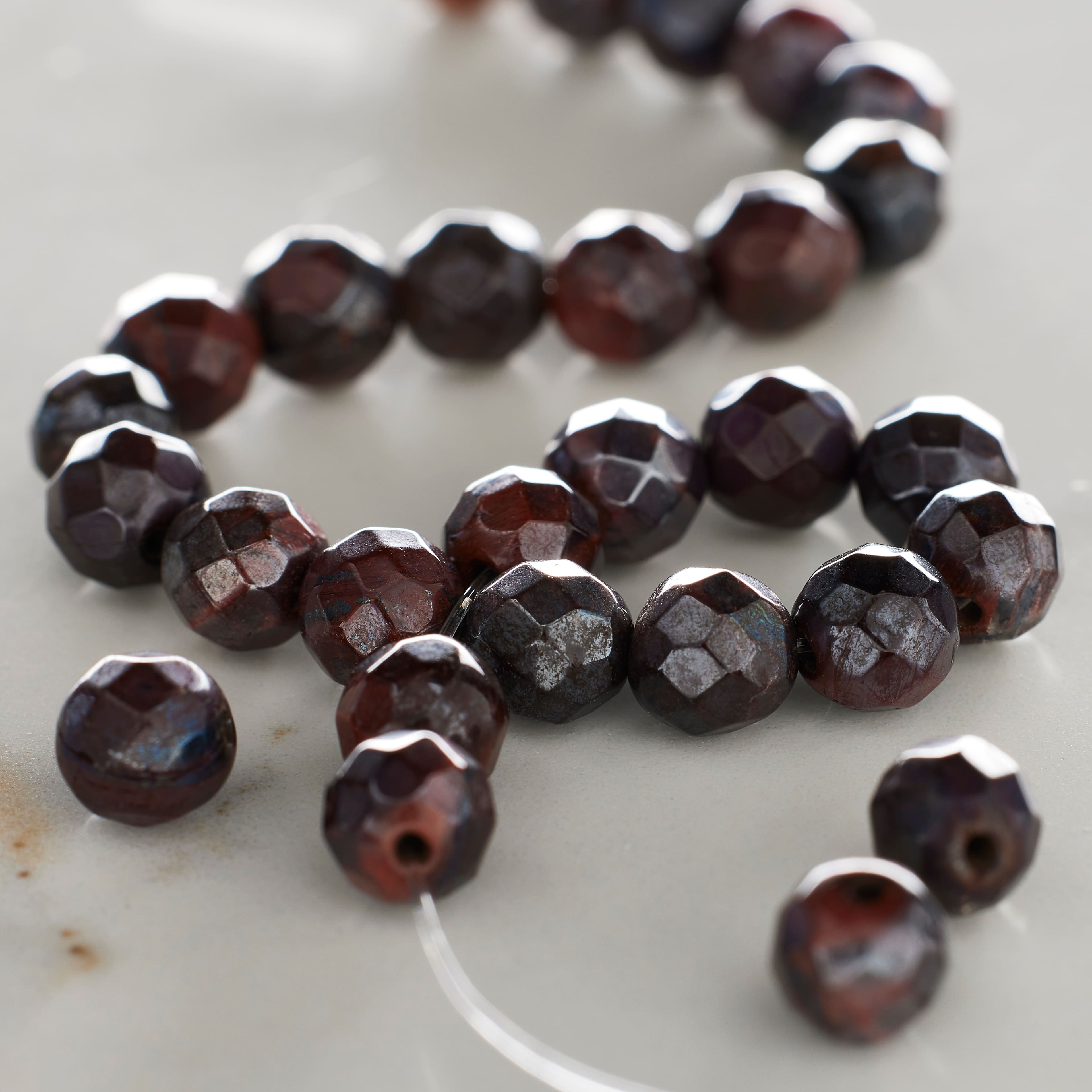 12 Pack: Red Silverite Tiger's Eye Faceted Round Beads by Bead Landing™, 6mm