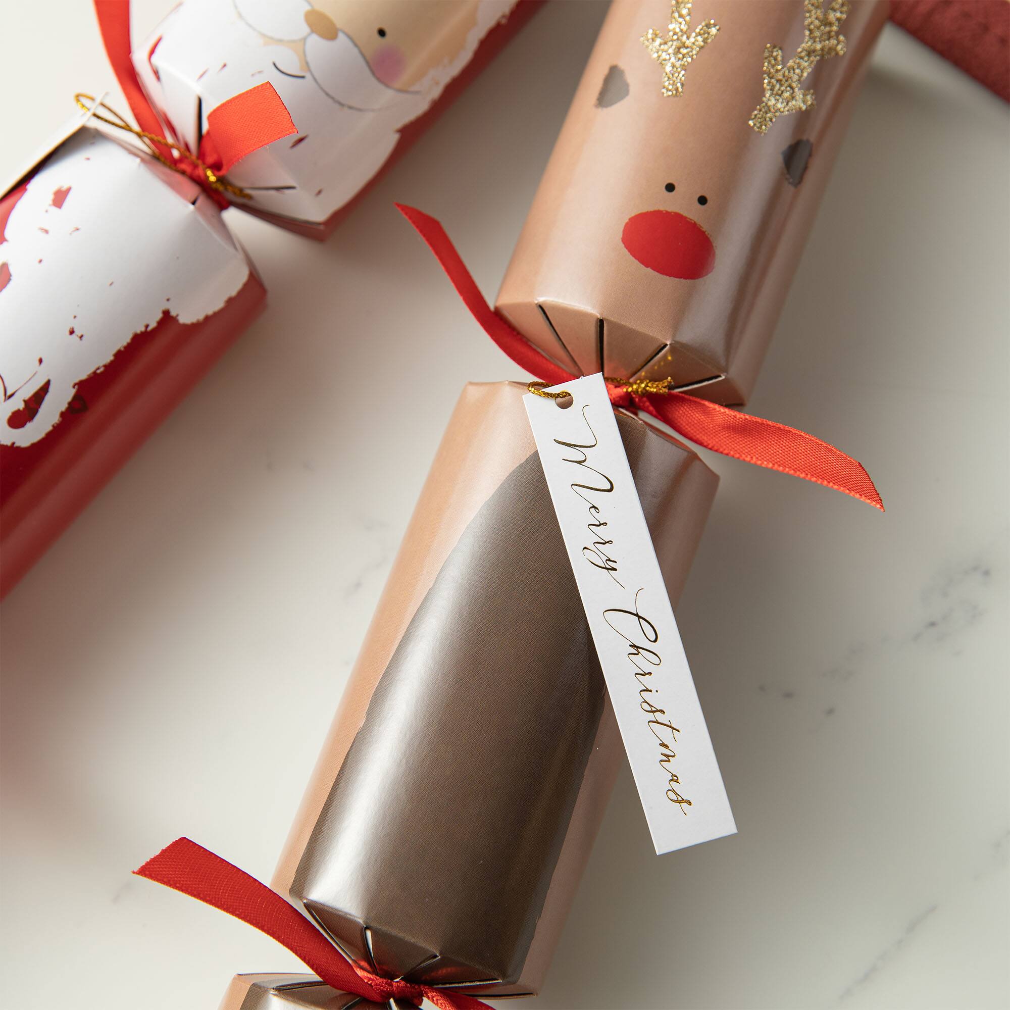Glitzhome&#xAE; 12&#x22; Christmas Santa, Snowman, Penguin &#x26; Reindeer Party Cracker with Gift Contents, 6ct.