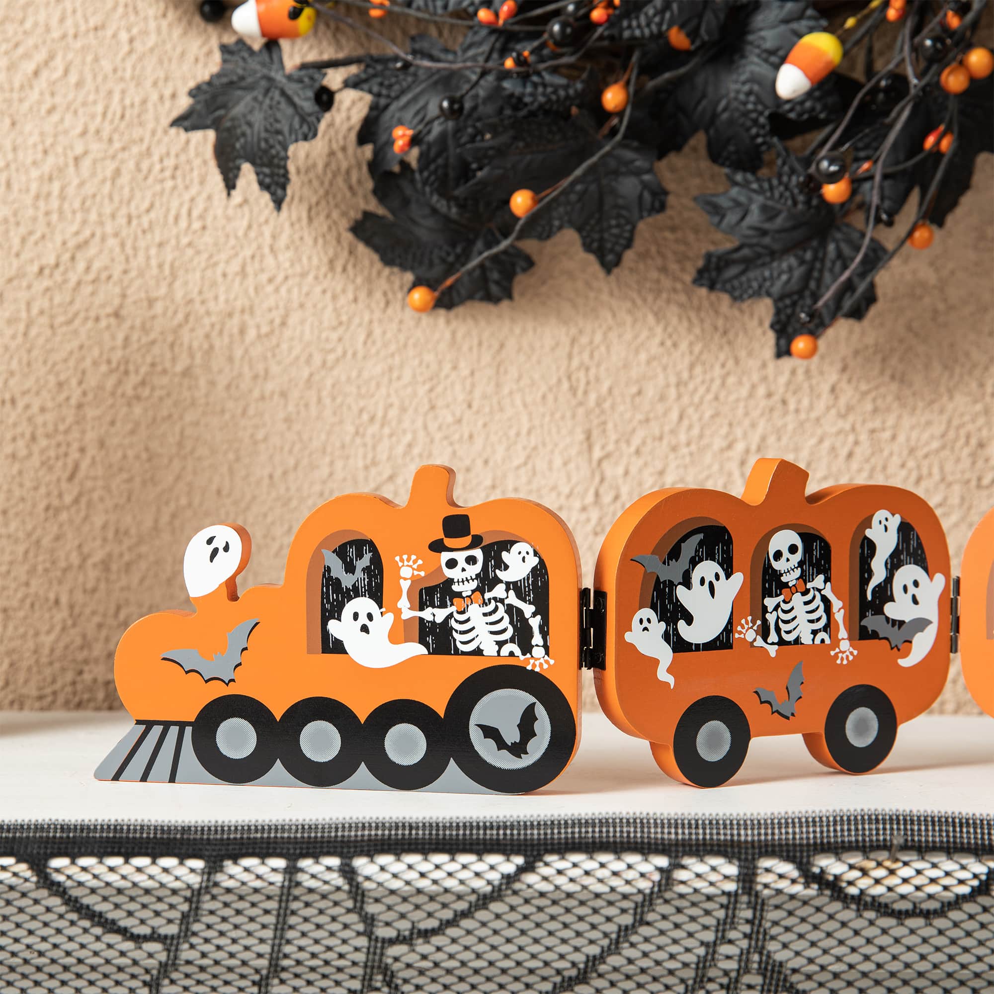 Glitzhome® 16" Halloween Skeletons & Ghosts Hinged Pumpkin Train Décor