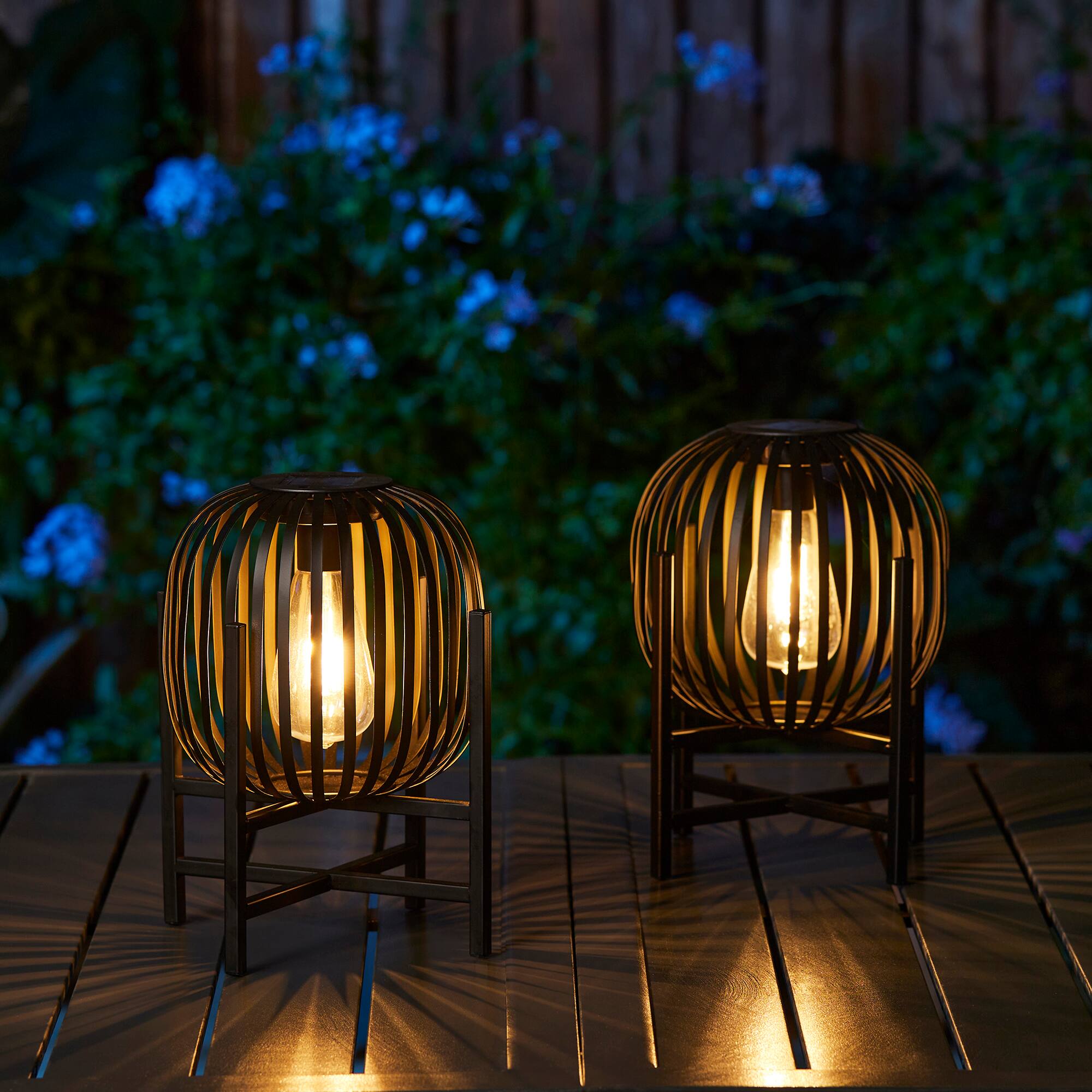 Glitzhome® 11.5" Black Slim Metal Stripes Solar Powered Edison Bulb Outdoor Lantern, 2ct.