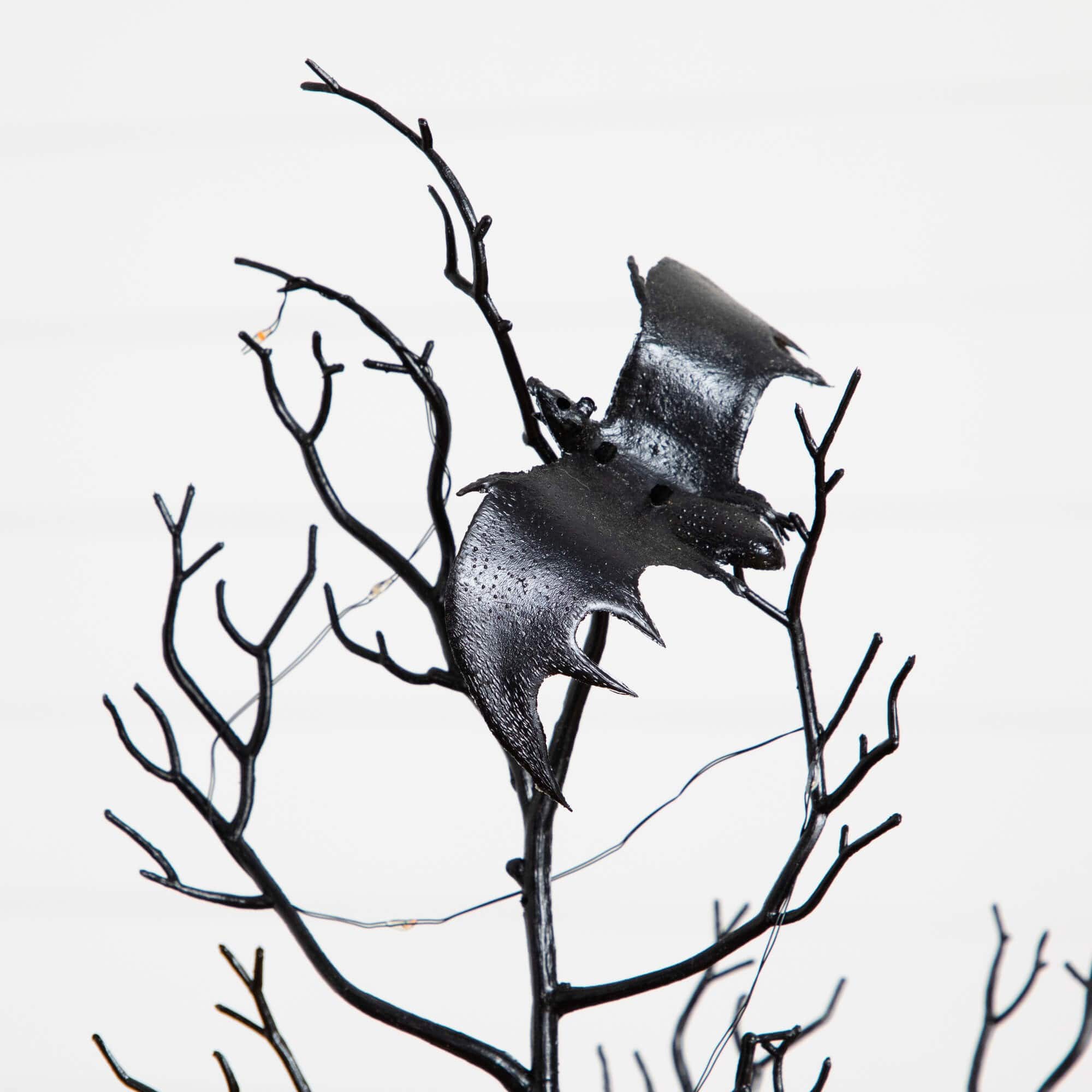 4ft. Pre-Lit Artificial Halloween Black Spooky Twig Tree with Bats and 120 Orange &#x26; Purple LED Lights