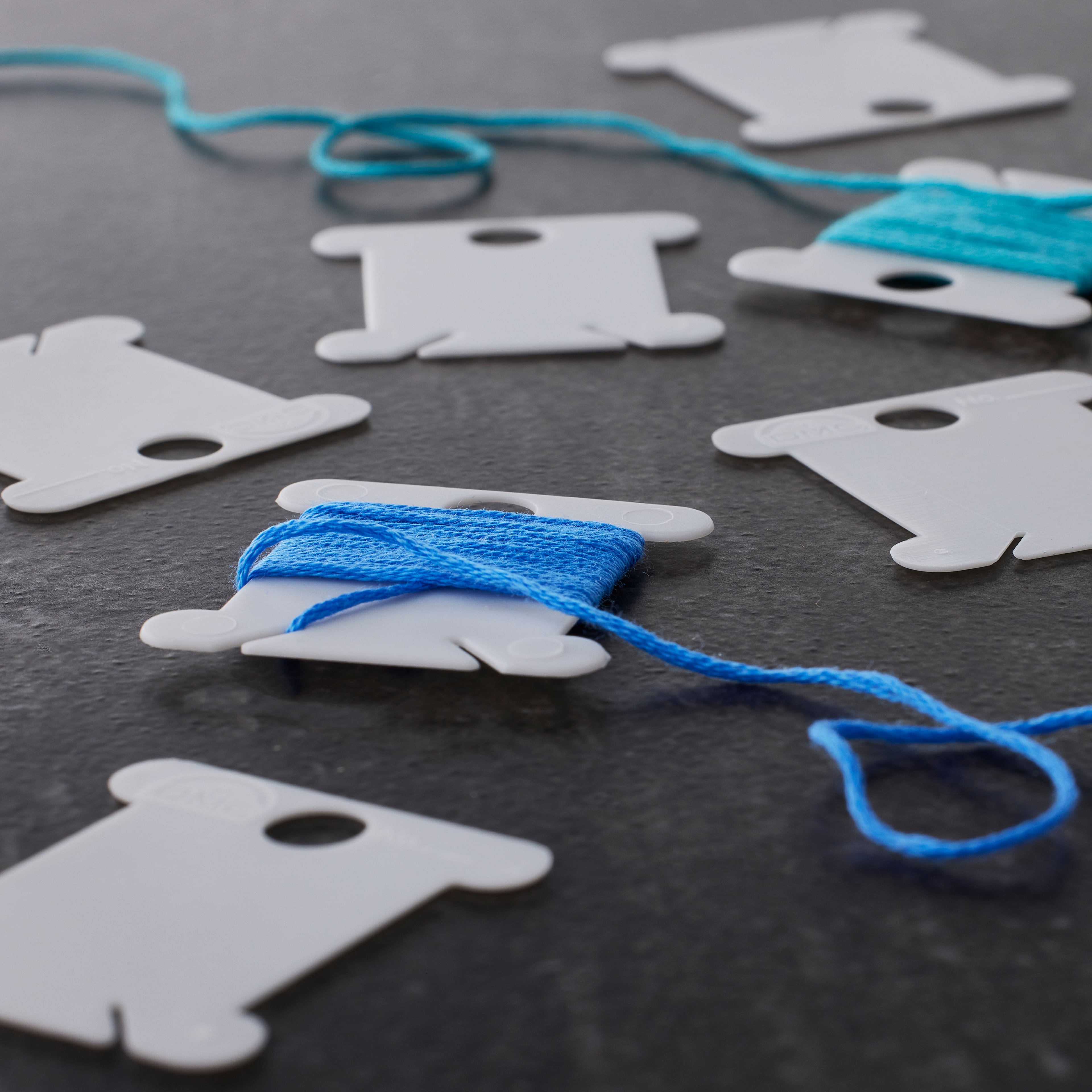 24 Packs: 28 ct. (672 total) DMC® Plastic Bobbins