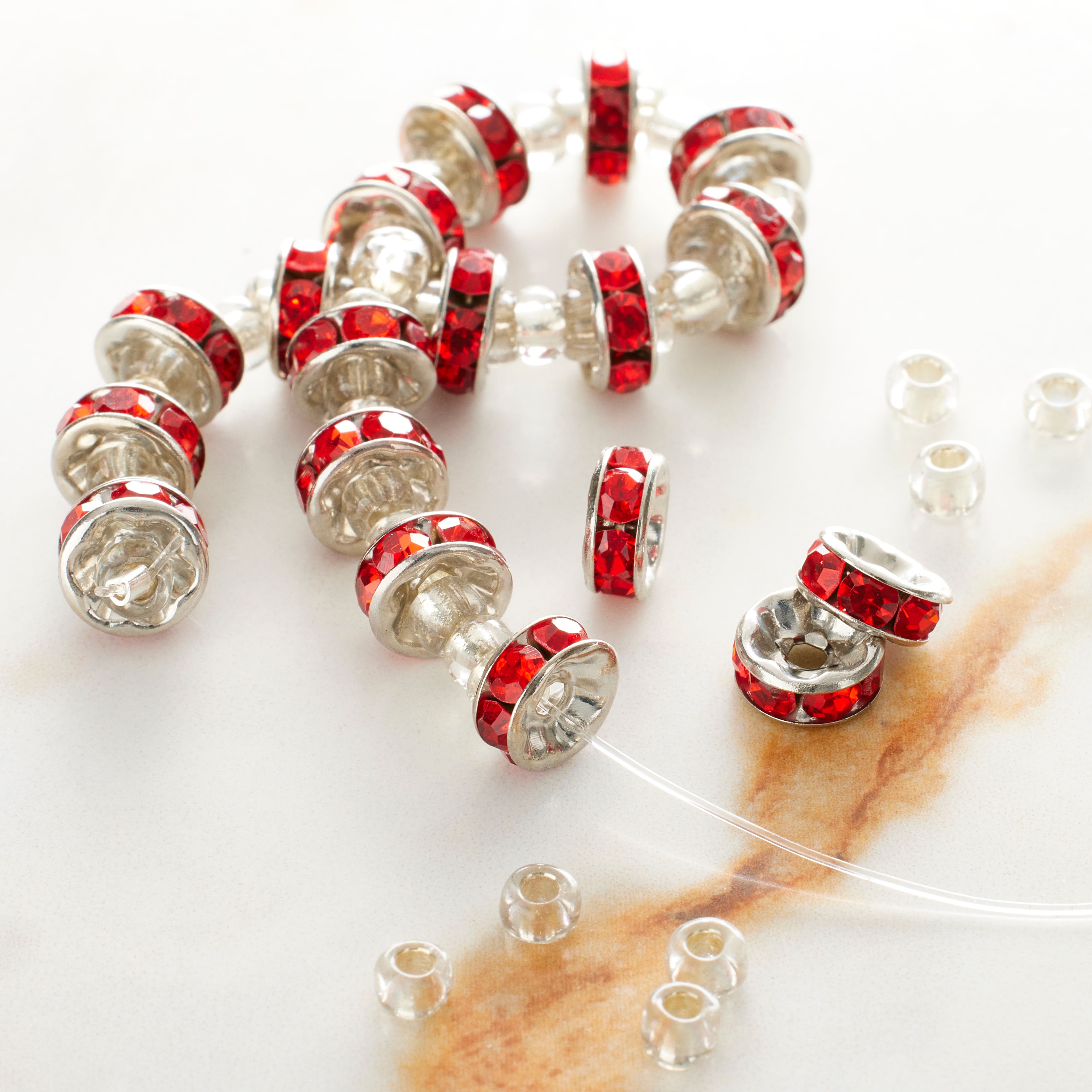 12 Pack: Red Rhinestone Studded Rondelle Beads, 8mm by Bead Landing™
