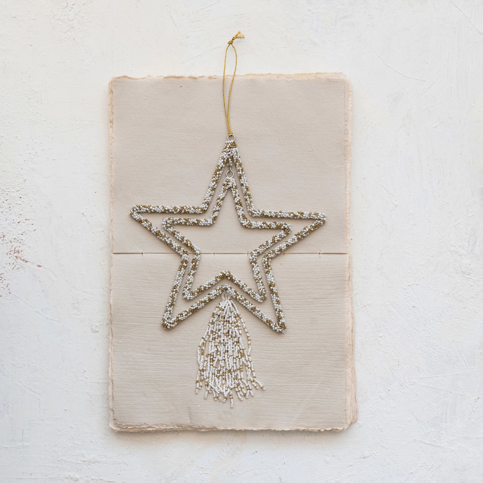 Hello Honey® 10" Gold & White Metal Star Glass Beaded Ornament with Tassel